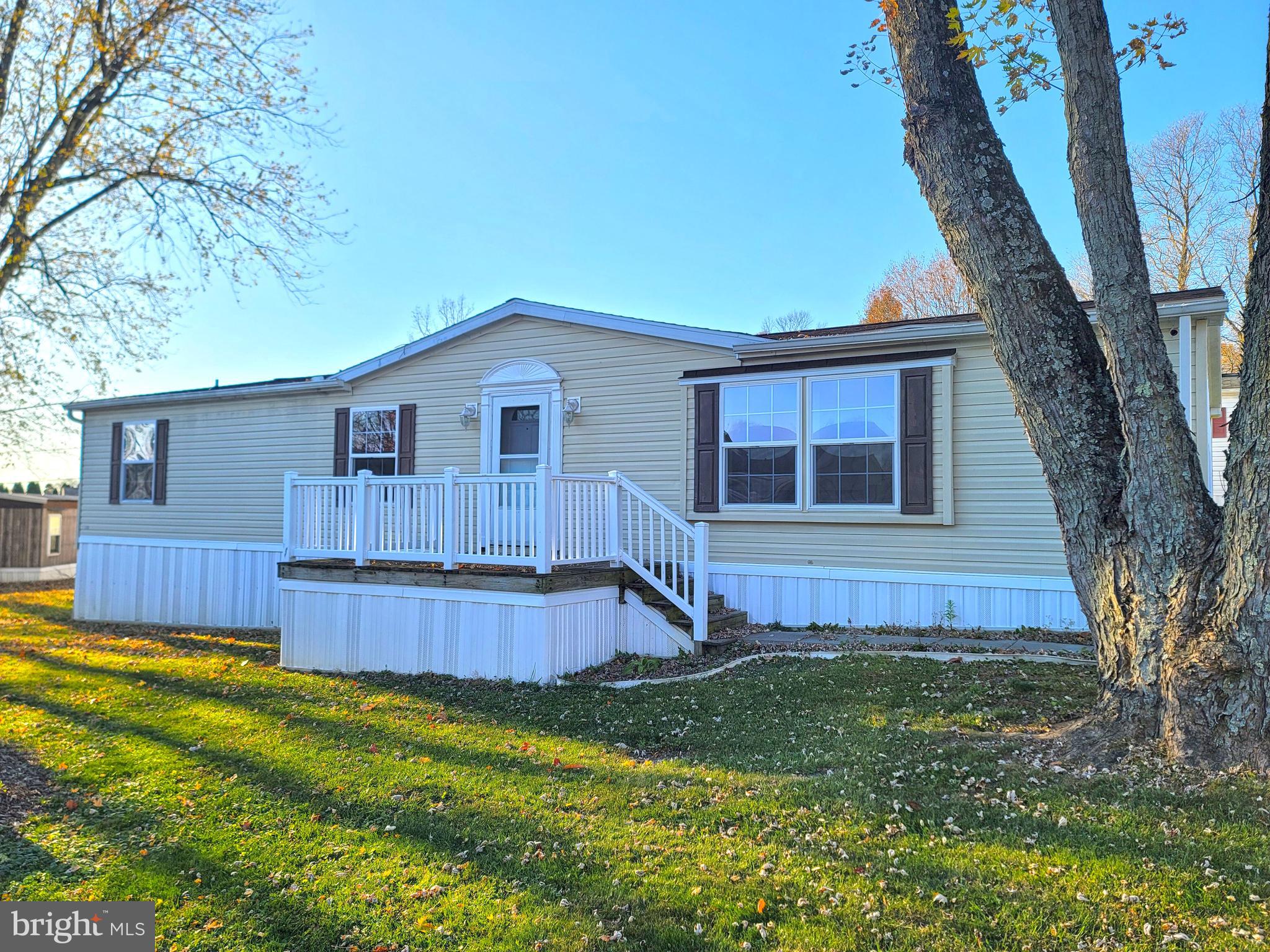 Welcome to this 2003 Redman double-wide manufactured home at 214 Michael Rd, Honey Brook, PA 19344, tucked in comfortably in Hideaway Mobile Home Park. Spanning roughly 1450 square feet, this home is well laid out with 3 bedrooms and 2 bathrooms, suitable for a variety of needs.

The interior features a welcoming living room with carpet and a ceiling fan, leading to a functional kitchen equipped with new appliances, a refrigerator, a built-in microwave, and a gas stove are all included to make this home truly move-in ready. The dining area adjacent to the kitchen offers a cohesive space for meals and gatherings. The spacious living room will accommodate any gathering comfortably. The master bedroom includes an ensuite bathroom, providing a private retreat. The home also features a second bathroom with a stall shower, complementing the tub/shower combo in the other bathroom.

One of the recent upgrades includes a brand-new roof, enhancing the home's value and durability. With the lifespan of modern roofing materials, you will not need to worry about any issues for decades to come. Outside, the property has small porches at the front and back, offering space for outdoor relaxation.

Positioned just off Route 322, this home benefits from easy access to local amenities and conveniences. The ground rent fee is a straightforward community living arrangement, bypassing the complexities of traditional HOA fees.

This property represents a balanced option for those seeking a manageable and comfortable home in Honey Brook, with essential features for everyday living and the added advantage of a great location.