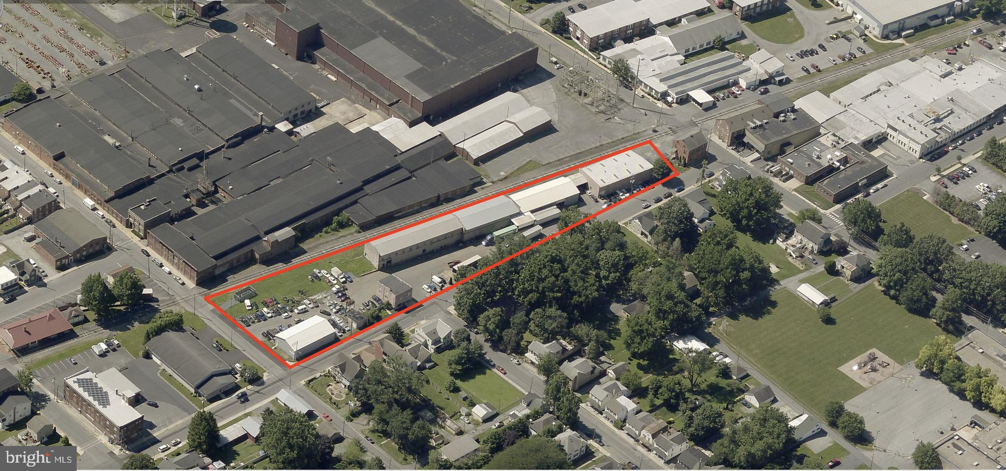 Owner currently occupies the 13,635 SF building and is willing to vacate or leaseback. This industrial property presents a versatile opportunity with four buildings (three industrial and one 2-story office) totaling 24,537 square feet on a 1.81-acre site. Property features 7 dock-high doors and 3 drive-ins.

The largest building offers +/- 13,635 square feet of warehouse space and provides flexibility for an owner to occupy all or a portion for their business or lease back to the current owner. The two remaining industrial/auto garage are currently leased with flexible terms, allowing for conversion to NNN, rent increases, or the option for an owner to occupy the space for their own business use. The 2,472 square foot office building is currently owner occupied but will be vacated before settlement or leased back by the current owner.

Building 1 - 14,000 square feet industrial/warehouse
Building 2 - +/- 4,800 square feet industrial/warehouse
Building 3 - 5,150-square-foot metal-panel industrial building, currently utilized as an automotive repair garage, and a 400-square-foot storage garage.
Building 4 - 2,472-square-foot, two-story office building.

With level street-grade access, ample parking, and strong road frontage in Manheim, PA, this property is well-suited for a variety of auto, industrial, warehouse, or manufacturing uses. The combination of owner-occupied and income-generating tenant spaces makes it an attractive option for investors and business owners alike.