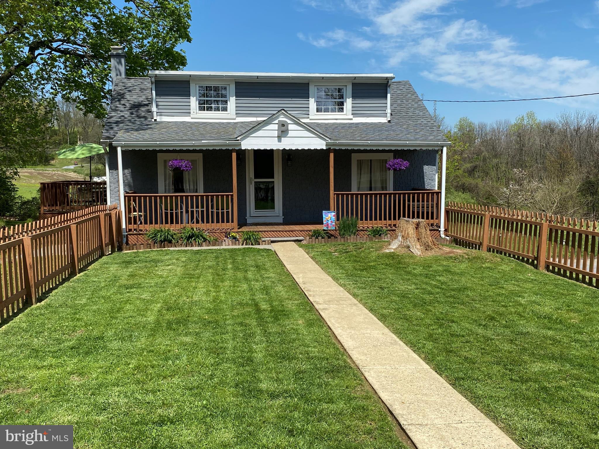 Welcome to 58 Woodside Ave. Situated in the quiet Alsace Manor neighborhood, on a large double lot, this updated Cape Cod is a definite must see. The home is located across the street from the neighborhood park/playground which is great for outdoor activities and get togethers. Upon arrival to the home, you will be greeted by a fenced in front yard and large covered front porch which is perfect for kids, pets, and entertaining. Once you enter the home, you will walk in to the large open concept living room and kitchen. The vaulted ceilings, loads of natural light, stainless steel appliances and quartz countertops really make the place shine. Out the back door you can enjoy some additional outdoor space on your private rear deck which overlooks the corn field, perfect for grilling and outdoor dining. Down the hallway you will find the master bedroom with high ceilings, an additional bedroom and updated full bathroom. Down the stairs is a finished basement with space for an office or potential 3rd bedroom, the laundry room and an additional rec room / bar room area. Call today with any questions and to schedule your  virtual tour.