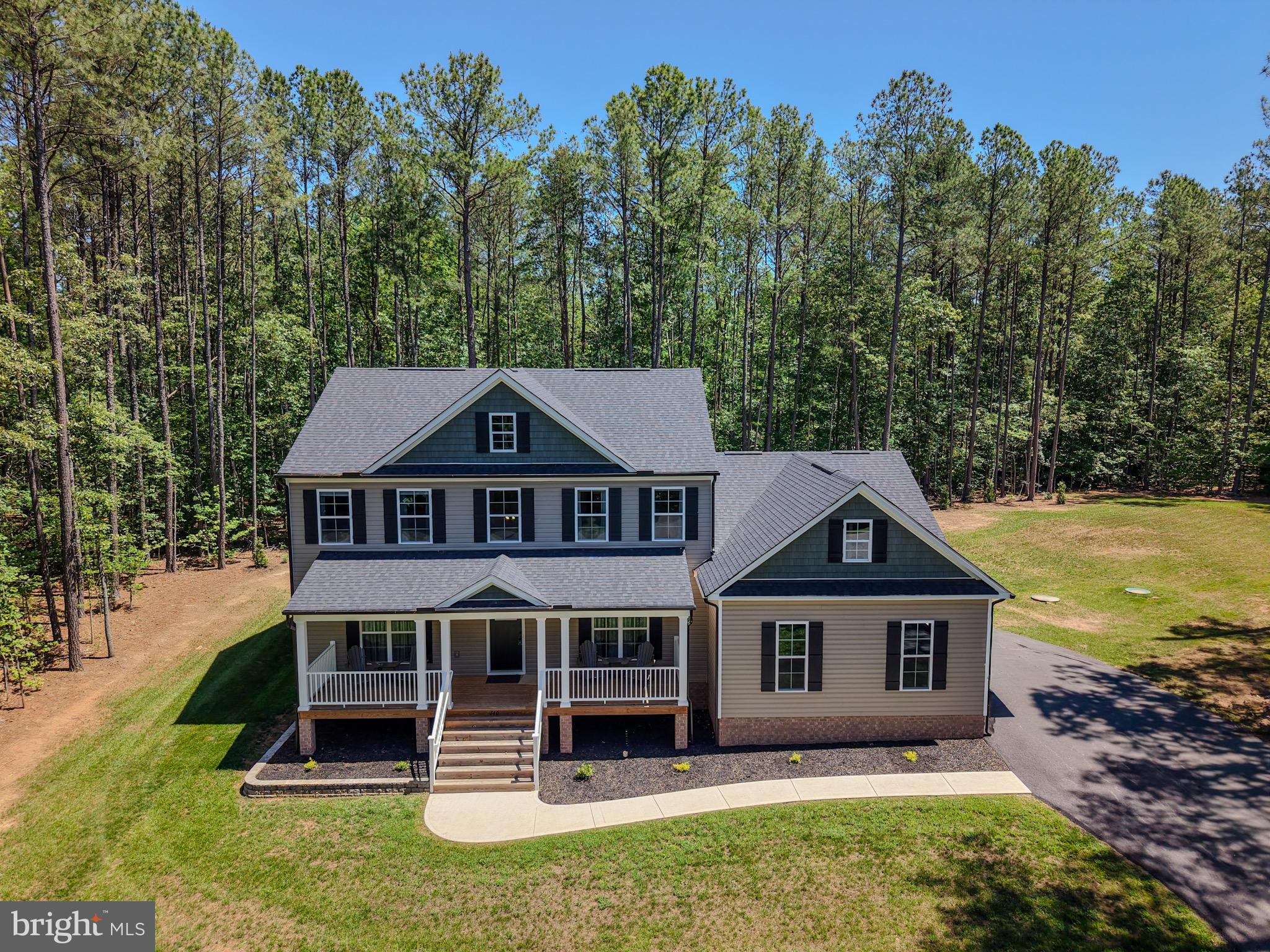 Welcome to Noah's Landing on the private side of Lake Anna.  Imagine sitting on the Wonderful front porch enjoying the privacy of 1.5 acres. This lovely 4 bedroom home Welcomes you as you first enter the 2 story foyer. Main level Master Bedroom with en-suite offering a soaking tub and walk-in shower. A Great family room that is open to the Breakfast area and Kitchen area. A separate Dining room for more space for entertaining. Upstairs you have a Large Great room open area overlooking the foyer area. The bedrooms have overhead lighting and walk in closets.  Pull down attic for additional storage. 
2 Car Garage with racks installed thru-out. This home is Move in ready only 1.5 years old. Driveway will be sealed prior to closing. The neighborhood offers a ramp for boating, fishing,  and having fun on the Private side of the lake.  Tennis courts, Basketball Courts and common area to enjoy.
