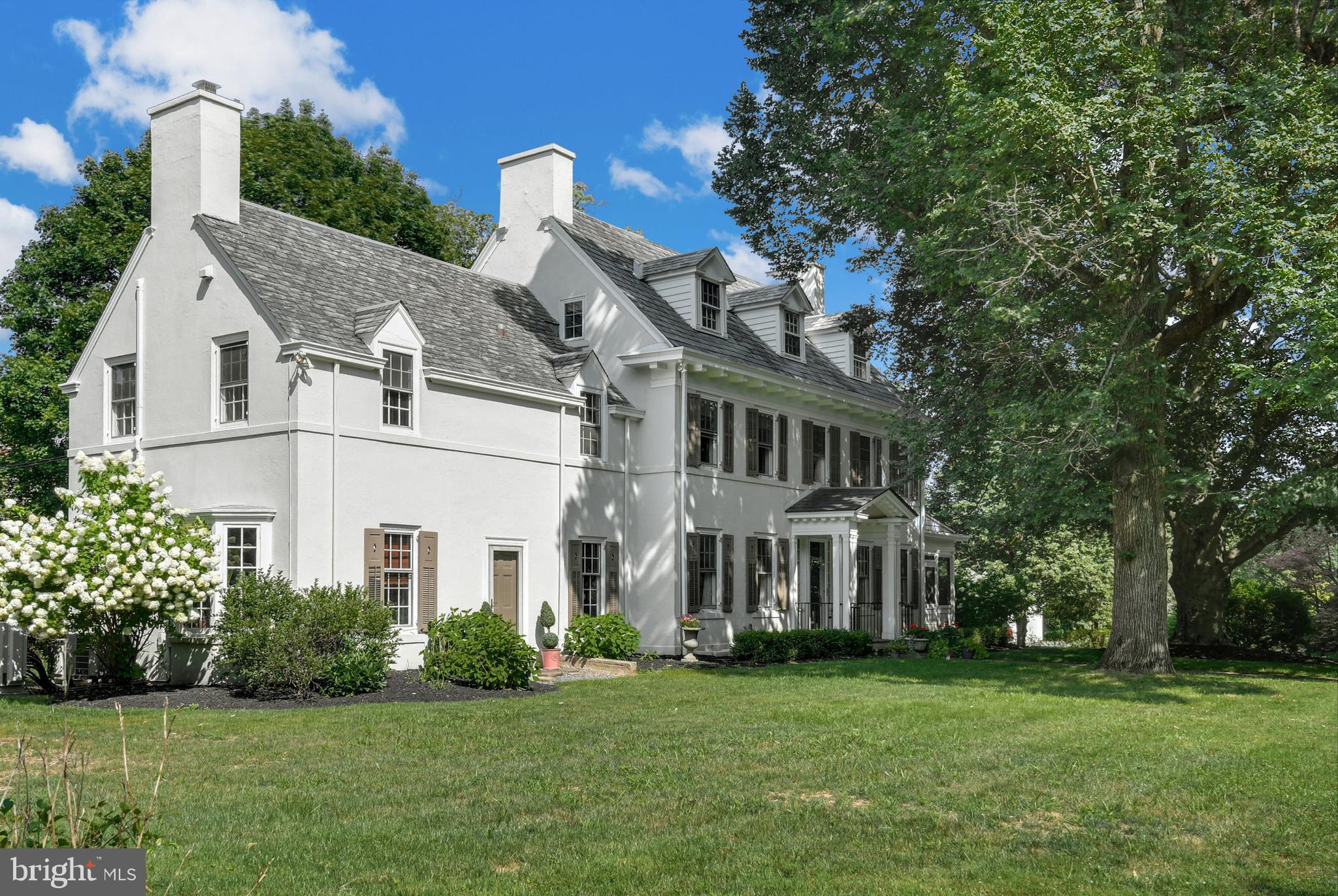 Tioga Manor stands proudly on a flat half acre corner lot in desirable downtown Bethlehem. Stately trees and meandering sidewalks are woven throughout Old Rosemont, a quintessential neighborhood of custom crafted homes. 

     Built in 1928, the stunning interior has been masterfully updated with gleaming hardwood and marble floors, custom built-ins, and beautifully detailed woodwork and moldings. The 5,100 square foot home includes four fireplaces, three fully finished floors, and formal living and dining areas. Tasteful renovations have been skillfully blended to retain the charm and detail of a bygone era. Newly remodeled, the kitchen and butler’s pantry are sleek with leathered marble and quartzite countertops, high end stainless appliances, and a stylish banquette breakfast area. Five bedrooms and four bathrooms provide luxurious accommodations on the upper levels. A newly added screened porch is a delight on warm evenings, along with the covered back porch and brick patio, picture perfect venues for morning coffee or dinner al fresco. A slate roof, public water and sewer, and attached garage with 2 bays enhance the property.
