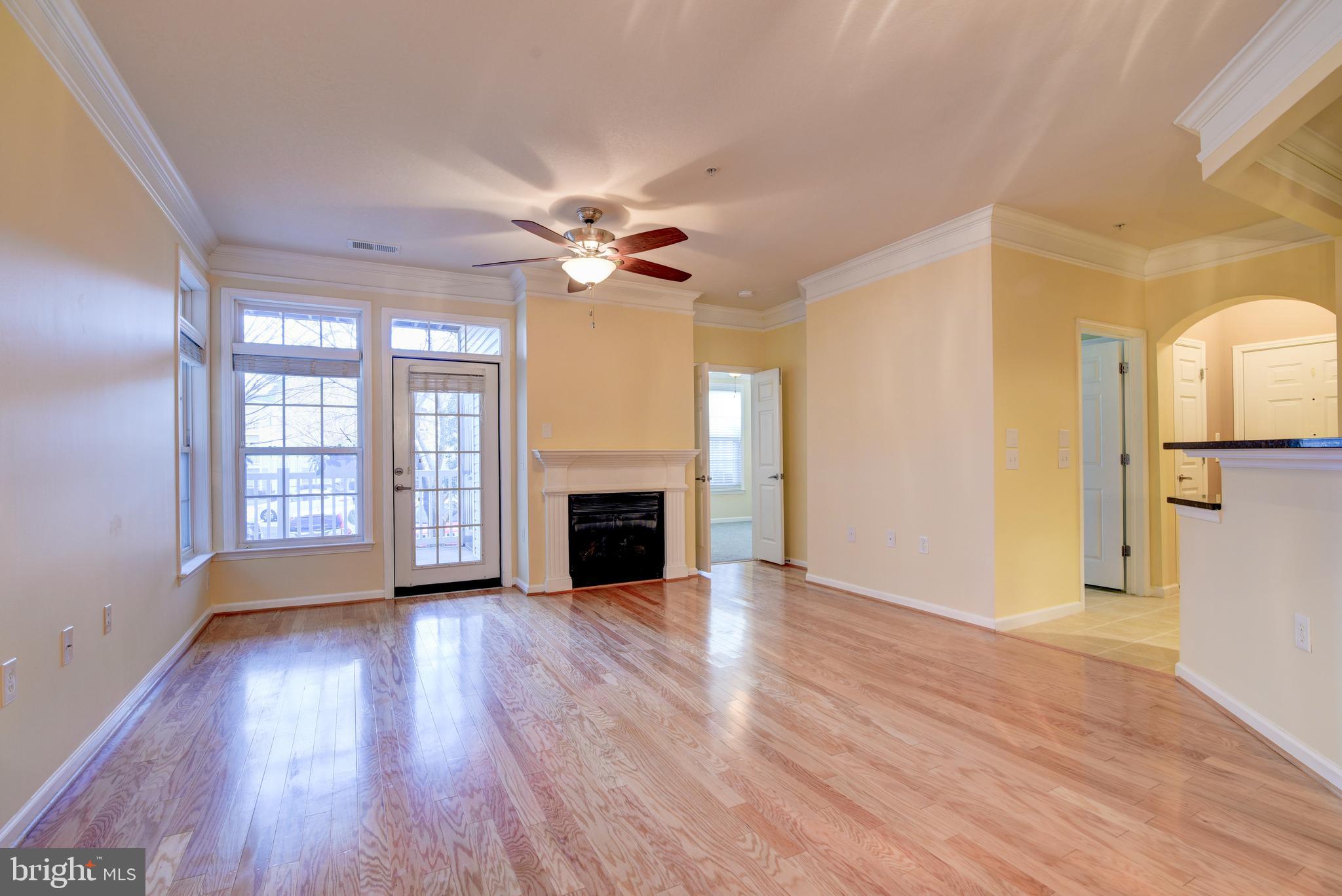 1st FLOOR CONDO - STRATFORD CLUB - Immaculate two-bedroom/bath with  gas fireplace, shimmering wood floors, high molded ceilings, new carpets, slatted blinds throughout. Kitchen features under-lit 42" maple cabinetry, granite counters, tile floors lighting & pantry.  Both spacious bedrooms have walk-in closets & tile bathrooms en suite. The inviting over-sized patio offers additional entertaining space the summer long. Great commuter location within minutes of Toll Road/267, Routes 7 & 15, restaurants, shopping & Historic Leesburg too!  Stratford Club amenities include an outdoor pool, a very well-equipped gym, business center,  pool room & entertainment room.  NO PETS OR SMOKING!