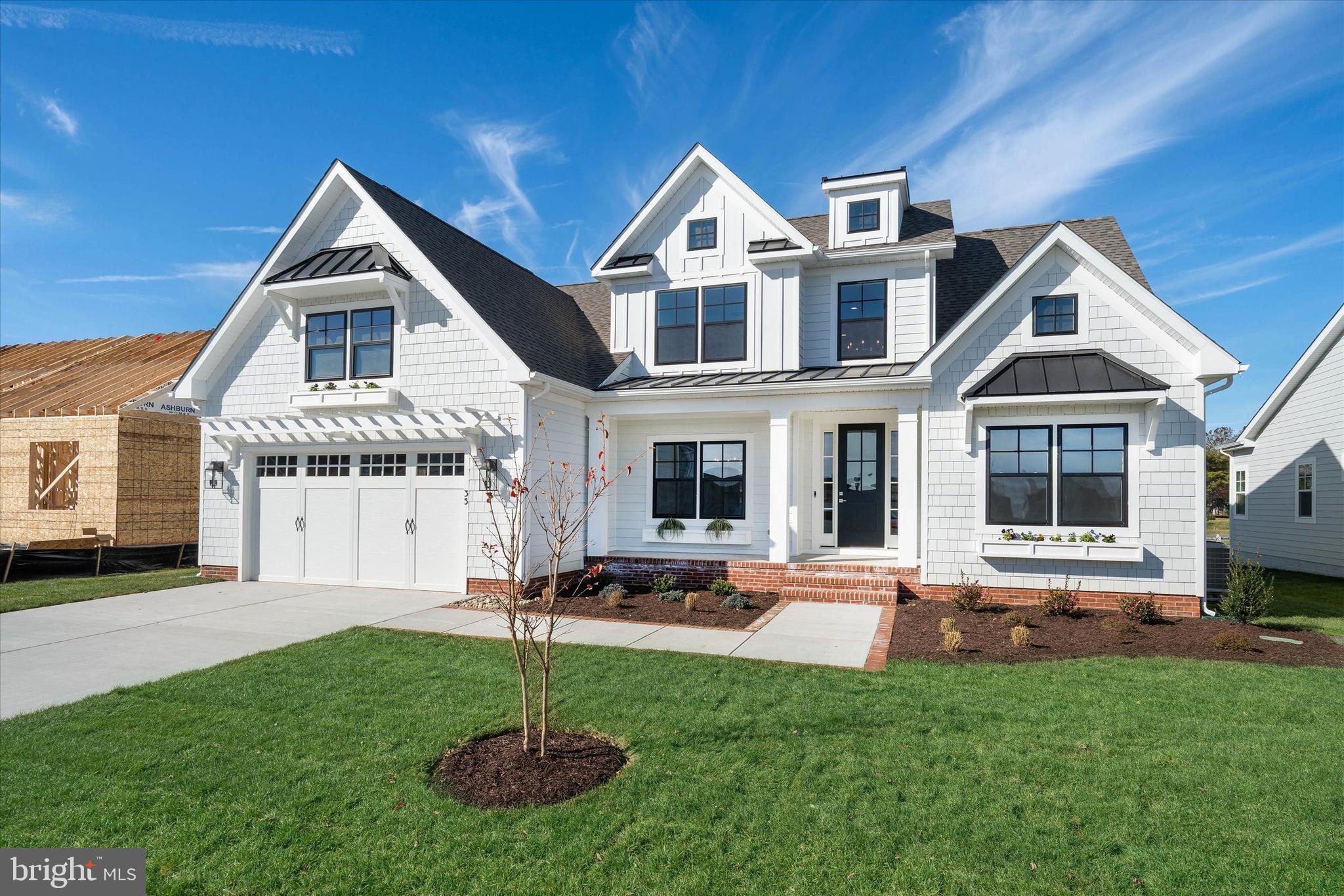 Brand new luxury home in downtown Lewes! Built by award-winning local builder, Capstone Homes, this brand new, custom Hannah home on lot 14 in Olde Town at Lewes is the first of it's kind, and ready for YOU! The Hannah is Capstone's modernized farmhouse floorplan and boasts an elegant two-story great room, first floor primary suite, office space, and a spacious kitchen layout conveniently located off the oversized mudroom. Capstone has designed this particular Hannah to feature all premium options possible, beginning with the upstairs, which has been expanded to include 4 bedrooms (one with an ensuite bathroom), plus additional storage. Not to mention the 900+ sq feet of finished rec room and full bathroom in the basement. Capstone Homes goes a step above the competition by offering standard what some call upgrades. The additional features in this Hannah go above and beyond, starting with a Chef's Kitchen with WOLF Sub-Zero appliances, cast iron farmhouse sink, 600 series Waypoint cabinetry to the ceiling, with a Quartz countertop and custom hood vent. The luxurious primary suite features a luxury bathroom with a tiled roman shower with mud pan and seat with a frameless glass shower door, plus sliding handheld showerhead and plenty of natural light. All bathrooms feature top-of-the-line tile, Moen Align plumbing fixtures, and Quartz vanity tops. To top it all off, the cosmetic details are second to none with wainscoting, custom lighting, a two-way fire place, custom trim - the list goes on.  Whether it's on the screened porch or beautiful flagstone patio with gas grill hook-up, there are numerous ways to entertain in this luxurious home. Additionally, with over 1,100 sq ft of storage space, there truly is a place for everyone and everything. This is just the beginning - call for a full list of features that this home has. Olde Town at Lewes offers in-town living with just a short bike ride to shops and restaurants and minutes from Cape Henlopen State Park and Lewes Beach! This home will be ready in November, just in time to enjoy the holiday season in your new custom home. Founded in 2006, this family-owned and operated local builder is committed to building quality homes throughout Sussex County. 
Capstone will pay half of the transfer tax when using their preferred lender - that's a huge savings! Call today to request a full list of Capstone’s standard features, upgrades and floor plan, or visit Karalyn at the Hannah model at Milton Crossing to learn more.