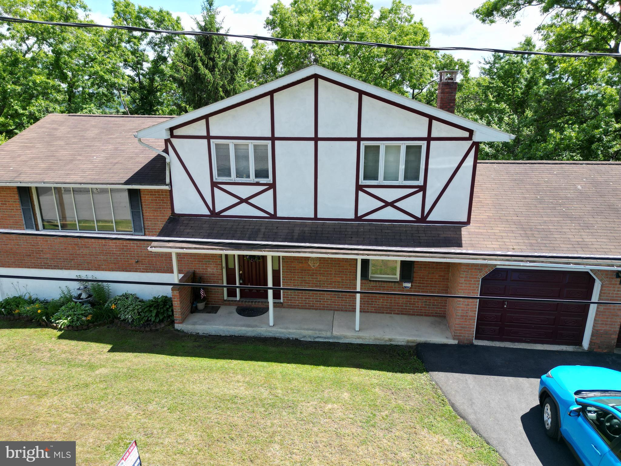 Welcome to 360 Ohio Ave in Shenandoah Heights. 3 Bedrooms, plus bonus room, Large eat in kitchen with large pantry. Living room has working fireplace. Bar in den off the patio that leads to inground pool. Sauna! 
Extra lot in rear Parcel# 36/09/0413.000 Plenty of storage. 2 car attached garage. See pics.