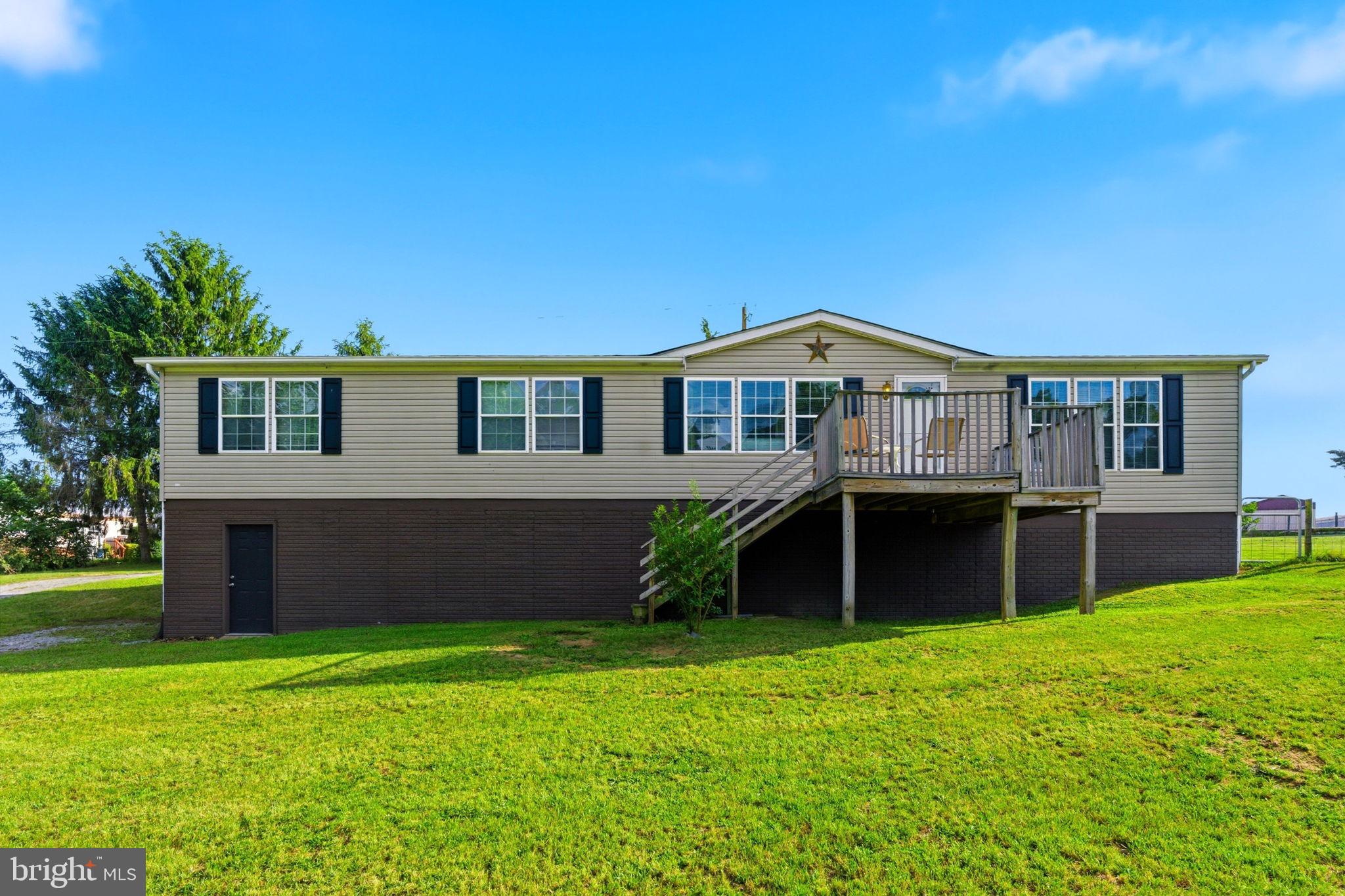 Discover the charm and comfort of this exquisite double-wide manufactured home, perfectly situated on a generous 0.91-acre lot. Built in 2000, this residence seamlessly blends modern convenience with a warm, inviting atmosphere, making it an ideal retreat for those seeking a luxurious lifestyle. Step inside to find a spacious interior that boasts 1,782 square feet of thoughtfully designed living space. The kitchen is equipped with high-end appliances, including a built-in microwave, electric oven/range, refrigerator, and dishwasher, ensuring that culinary adventures are both enjoyable and efficient. The adjoining dining space creates a harmonious flow, ideal for gatherings and celebrations. The home offers three generously sized bedrooms, each designed to provide a peaceful sanctuary for rest and relaxation. Two well-appointed bathrooms enhance the functionality of the space, featuring modern fixtures and finishes that elevate everyday routines. The flooring throughout the home combines plush carpeting and durable vinyl, providing both comfort and practicality. Natural light floods the living areas, creating a warm ambiance that invites you to unwind and make lasting memories. For those who appreciate additional space, the full unfinished basement with a side entrance presents endless possibilities. Whether you envision a personal gym, a workshop, or extra storage, this versatile area can be tailored to suit your lifestyle needs. Outside, the property offers off-street parking and a driveway, ensuring convenience for you and your guests. The expansive lot provides ample outdoor space for gardening, recreation, or simply enjoying the tranquility of nature. This home is not just a place to live; it's a lifestyle choice that embodies comfort, convenience, and a sense of community. Experience the perfect blend of luxury and practicality in this remarkable manufactured home, where every detail has been thoughtfully considered to create a welcoming environment. Embrace the opportunity to make this beautiful residence your own and enjoy the exclusive lifestyle it offers.