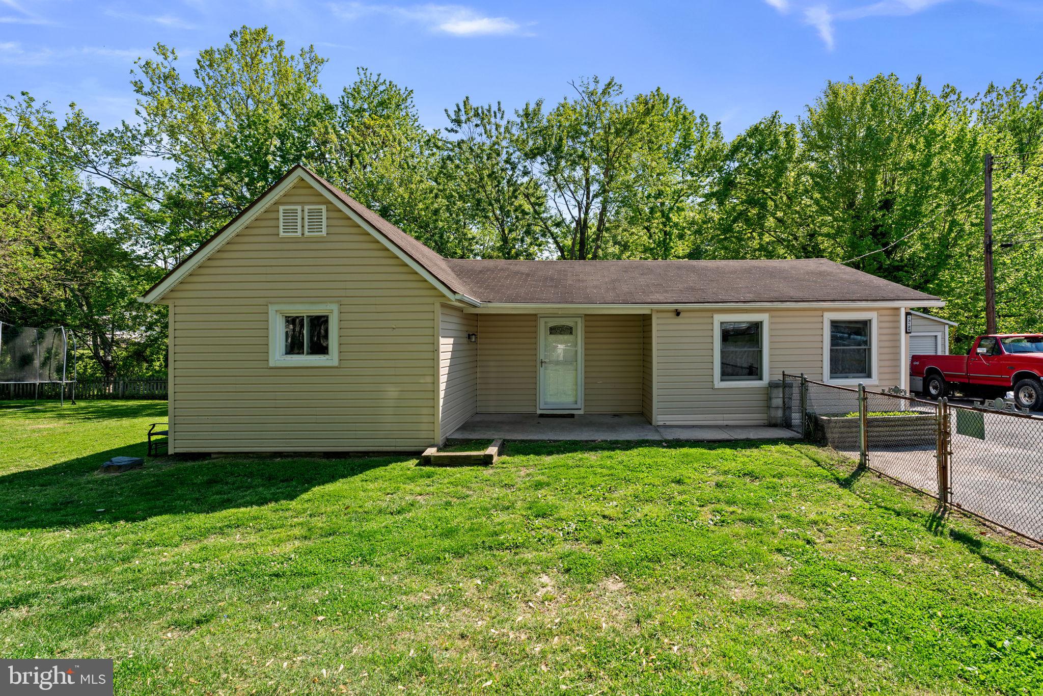 Discover the perfect blend of comfort and versatility in this charming Middle River rancher. Step inside to a bright, inviting living space that flows seamlessly into a modern eat-in kitchen, complete with sleek granite countertops, stainless steel appliances, and stylish LVP flooring. Whether you need a quiet home office or a third bedroom, the flexible floor plan adapts to your life. Outside, your private oasis awaits: a sprawling, level, fully fenced lot featuring a massive two-car detached garage and two additional outbuildings—perfect for hobbies, storage, or the ultimate workshop. Truly a "must-see" that feels like home the moment you arrive!