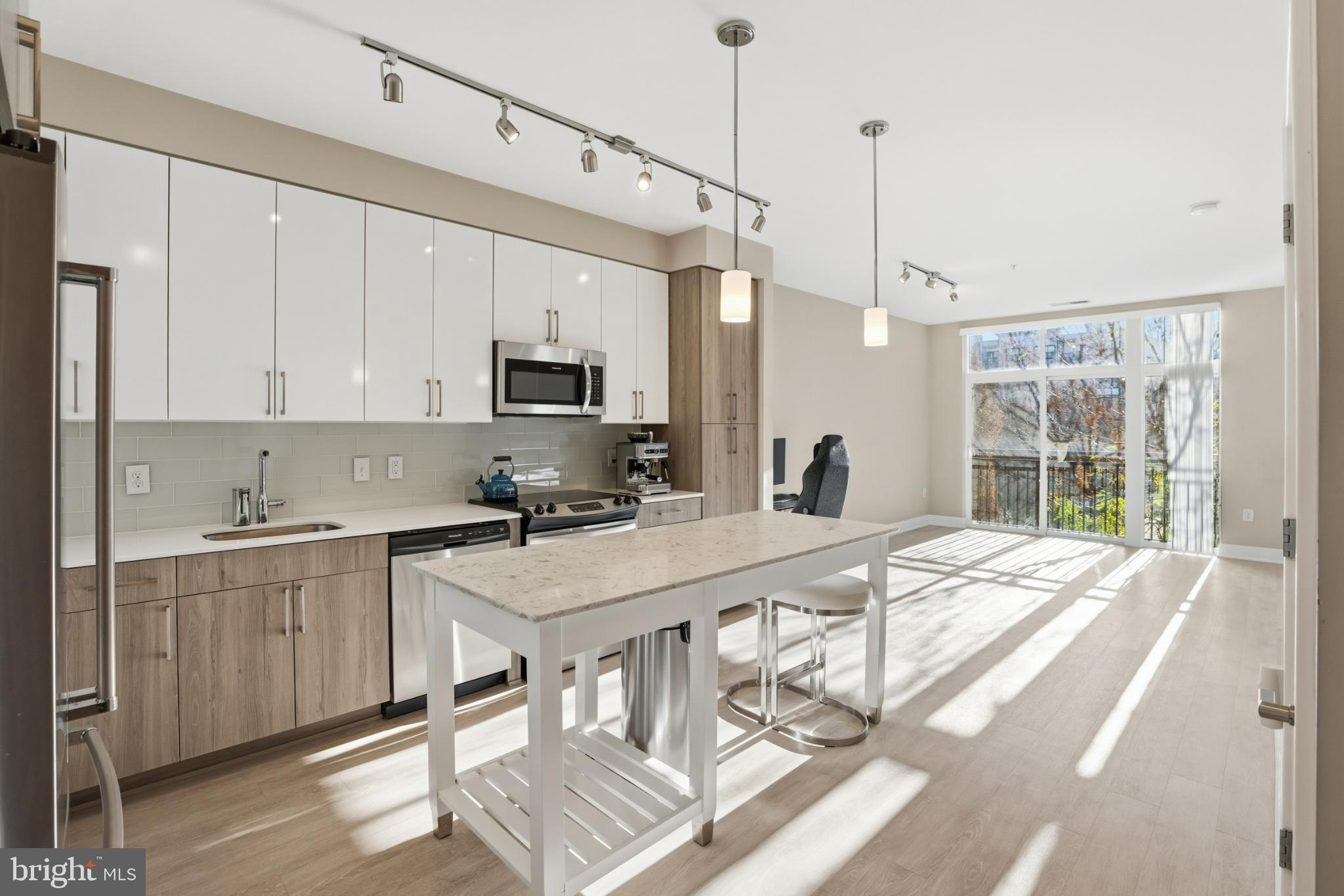 Discover modern living at The Haven Condominium, a contemporary mid-rise built in 2018. This 1-bedroom, 1-bathroom unit offers 737 sq. ft. of well-designed space, featuring essential appliances for your convenience: a built-in microwave, electric oven/range, refrigerator, dishwasher, and in-unit washer and dryer. Enjoy the ease of assigned parking in the garage and access to a range of community amenities, including a fitness center, outdoor pool, billiard room, and concierge services. The building is equipped with monitored security and a doorman for added peace of mind. With a focus on maintenance-free living, the association fee covers common area upkeep, lawn maintenance, and snow removal. Experience a vibrant community atmosphere with a clubhouse and meeting rooms for social gatherings. This property combines comfort, convenience, and modern amenities, making it an ideal choice for those seeking a stylish urban lifestyle.