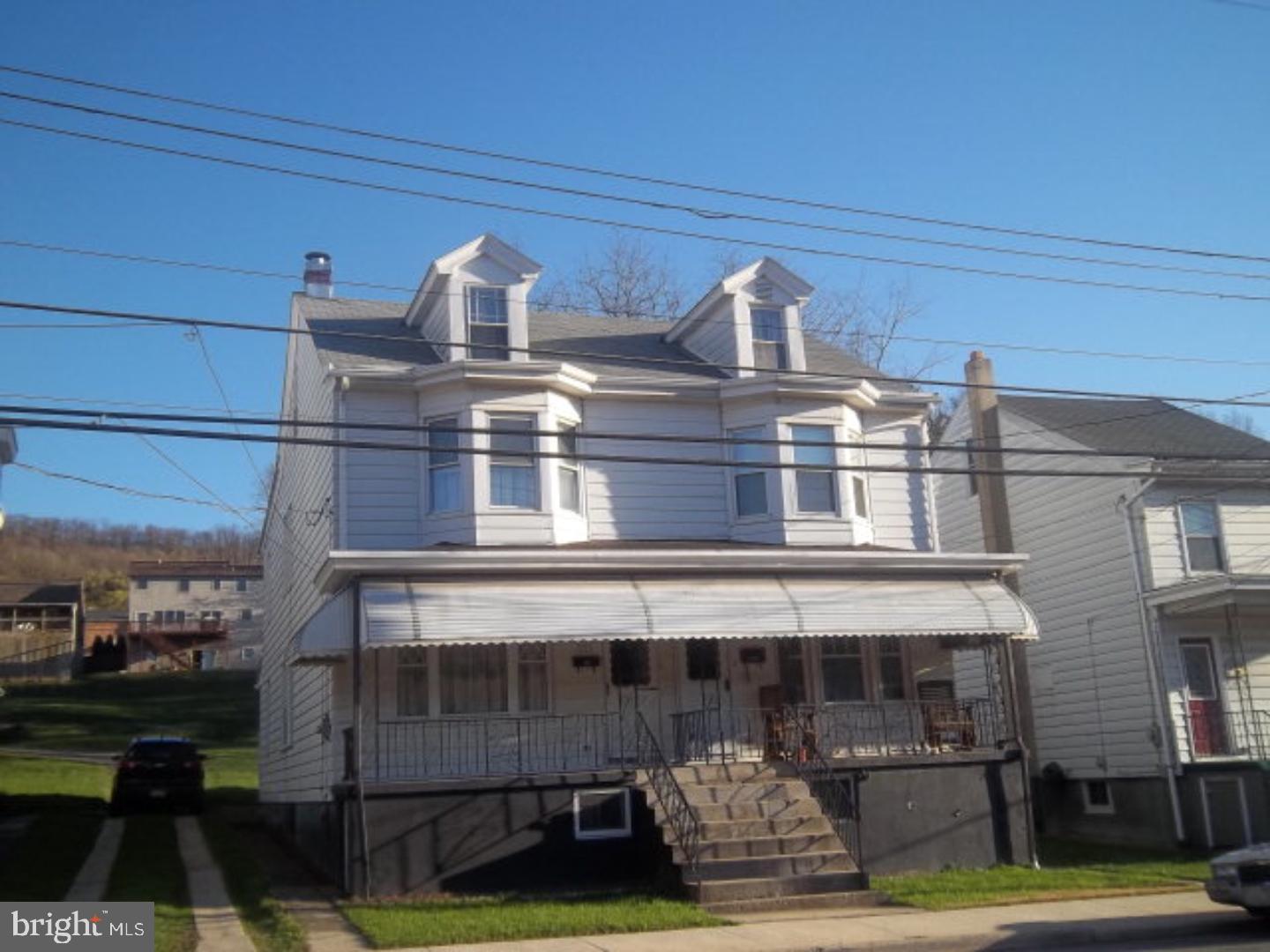Spacious & Cared For! Generous room sizes. Open Staircase. Some Replacement Windows. Welcoming front porch w/awning to shade summer's warmth. Rear porch for relaxing. Nice size lot for children & pets to romp. Heated attic is finished & ready for a teenager's retreat! Large eat-in kitchen. Convenient location. Off Street Parking may be possible. Shared driveway.  Mailing Address Continued: Pottsville  Color: White  Amp: 100