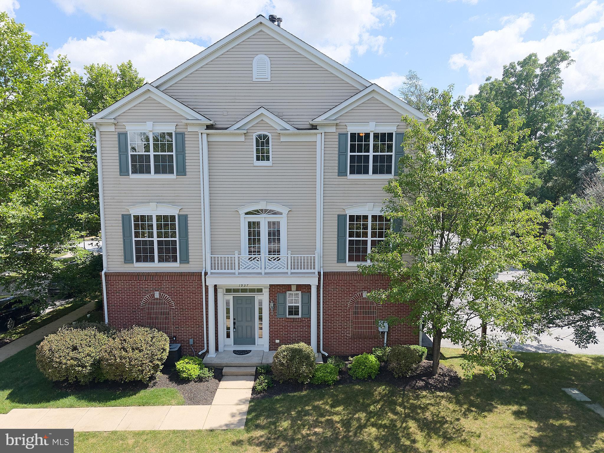 BEST VALUE in DOWNINGTOWN EAST SCHOOLS! Move right into this beautifully maintained and freshly painted end unit townhome in the highly sought-after Windsor Ridge community, where a private setting, abundant natural light, and exceptional convenience create the perfect place to call home. 
Step inside to gleaming hardwood floors and an inviting open floor plan designed for today's lifestyle. The main level boasts a striking two-sided gas fireplace which serves as the focal point between the elegant dining room and spacious great room, creating warmth and ambiance for both everyday living and entertaining. The sun-filled island kitchen features abundant cabinetry, gas cooking, stainless appliances, a cheerful breakfast area, and seamless access to a newer maintenance-free deck—perfect for morning coffee, outdoor dining, or simply relaxing while enjoying the peaceful surroundings. Upstairs, the spacious primary suite offers a tray ceiling, walk-in closet, and a private bath. Two additional light-filled bedrooms share a well-appointed hall bath, providing comfortable accommodations for family or guests. The versatile lower level includes a fourth bedroom or home office, a convenient laundry area, and direct access to the attached two-car garage. Residents of Windsor Ridge enjoy outstanding amenities, including a community pool, tennis and basketball courts, playgrounds, walking trails, and beautifully maintained open spaces. Ideally situated with easy access to major commuter routes, shopping, dining, parks, and the award-winning Downingtown East School District including the nationally ranked Stem Academy, this turnkey home offers an exceptional combination of location, lifestyle, and value. Don't miss this one!