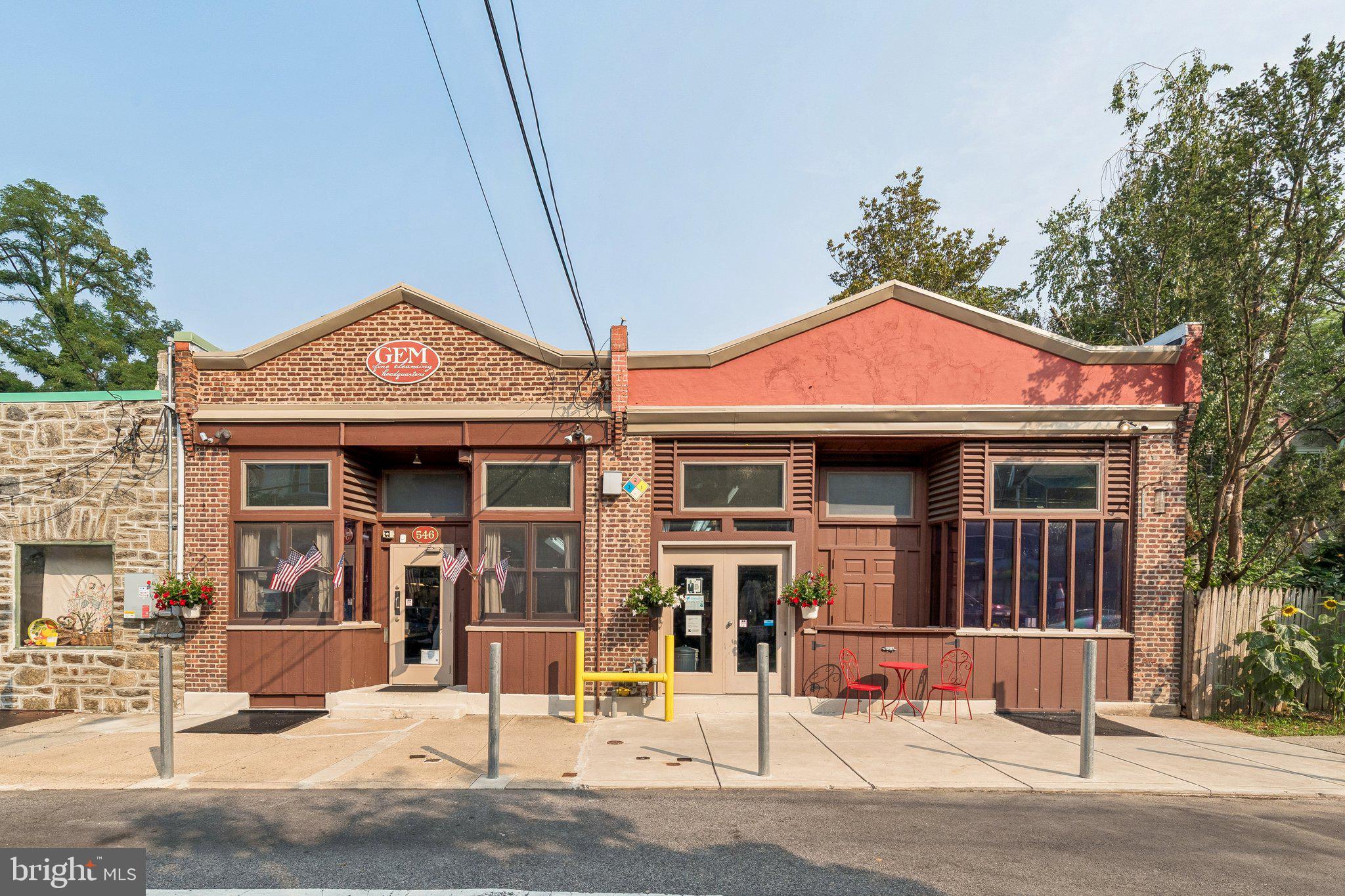 Exceptional opportunity to acquire a versatile commercial property in the heart of Mount Airy, one of Northwest Philadelphia's most established and sought-after neighborhoods. This offering includes two separately deeded parcels that have been thoughtfully combined into a single functional space while retaining individual ownership.
Encompassing approximately 3,800 square feet, the property is zoned CMX-2 Mixed Use, creating opportunities for a variety of commercial, mixed-use, and redevelopment possibilities, subject to applicable approvals. For more than six decades, the property has successfully operated as a neighborhood dry-cleaning business, demonstrating its longstanding utility while offering the flexibility to reimagine the space for its next chapter. Potential future uses may include retail, restaurant, office, creative workspace, mixed-use redevelopment, or residential units above the existing structure, where permitted.
Inside, expansive open floor plans span both buildings, connected by multiple interior openings, including access through the basement. Eleven-foot ceilings create an open, airy feel, while rooftop industrial ventilation fans support commercial operations. The property includes one full bathroom, three half baths, three interior stairways to the basement, and individual sidewalk steel cellar entrances for each building.
Recent improvements include a newly installed torch-down modified bitumen roof, providing added value and peace of mind. Along the front of the property, approximately 45 feet of designated loading zone offers convenient access for deliveries and day-to-day business operations.
Nestled within a charming neighborhood commercial enclave just a short distance from the vibrant Germantown Avenue corridor, the property enjoys the best of both worlds—a quieter setting with immediate access to one of Northwest Philadelphia's most active retail, dining, and community destinations. Located directly across from the popular Weavers Way Co-op, and on the same intimate strip as WW Mercantile, Blue Marble Bookshop, Mt Airy Arts Center, WPM Typewriter and Garden Shop, and Wildhand, this is a rare opportunity to acquire a highly adaptable commercial property in one of Philadelphia's most distinctive neighborhood communities.