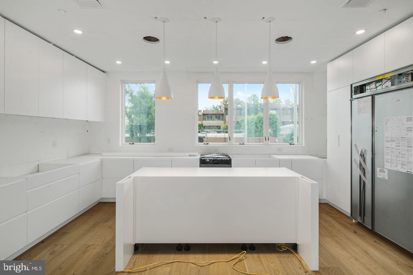 Enjoy luxury amenities at Moderna at Rittenhouse. Eight Revolutionary new homes designed by Shimi Zaken of Atrium design group. Each home will have a Tax Abatement, 2-car garage, Elevator, and approximately 4,898 square feet of living space and amazing luxuries throughout. Each home has a roof deck with skyline view and can have a plunge pool and outdoor kitchen. Moderna homes come equipped with Control-4 smart home systems included, 3-outdoor decks, chefs kitchen with Wolf/Sub-zero appliances package, quartz counters with 2cm eased edges, and custom cabinetry with soft close hinges. Moderna homes have a finished lower level with media room, wet bar and beverage center, custom closets throughout, multi zoned energy efficient HVAC system, and much much more. Located on one of the most desirable blocks in the neighborhood, convenient to the Lombard Swim club, Rittenhouse Square Park, and every wonderful amenity that makes Rittenhouse the most sought after neighborhood in Center City. New Construction town homes do not become available often in Rittenhouse! Moderna is located within the Albert M Greenfield School catchment. Some additional features include: 5 full bathrooms with custom tile work, frame-less glass showers, modern vanities with quartz counters, 2 half baths, Full size laundry room with whirlpool washer and dryer included and stainless steel laundry sink, wood clad windows throughout, solid core interior doors, interior metal railing system, upgraded extra thick drywall, upgraded energy efficient hot water heater, alarm system, sprinkler system, designer lighting and plumbing fixtures and a world class design. Estimated Square footage total includes above grade space and below grade space and is estimated.