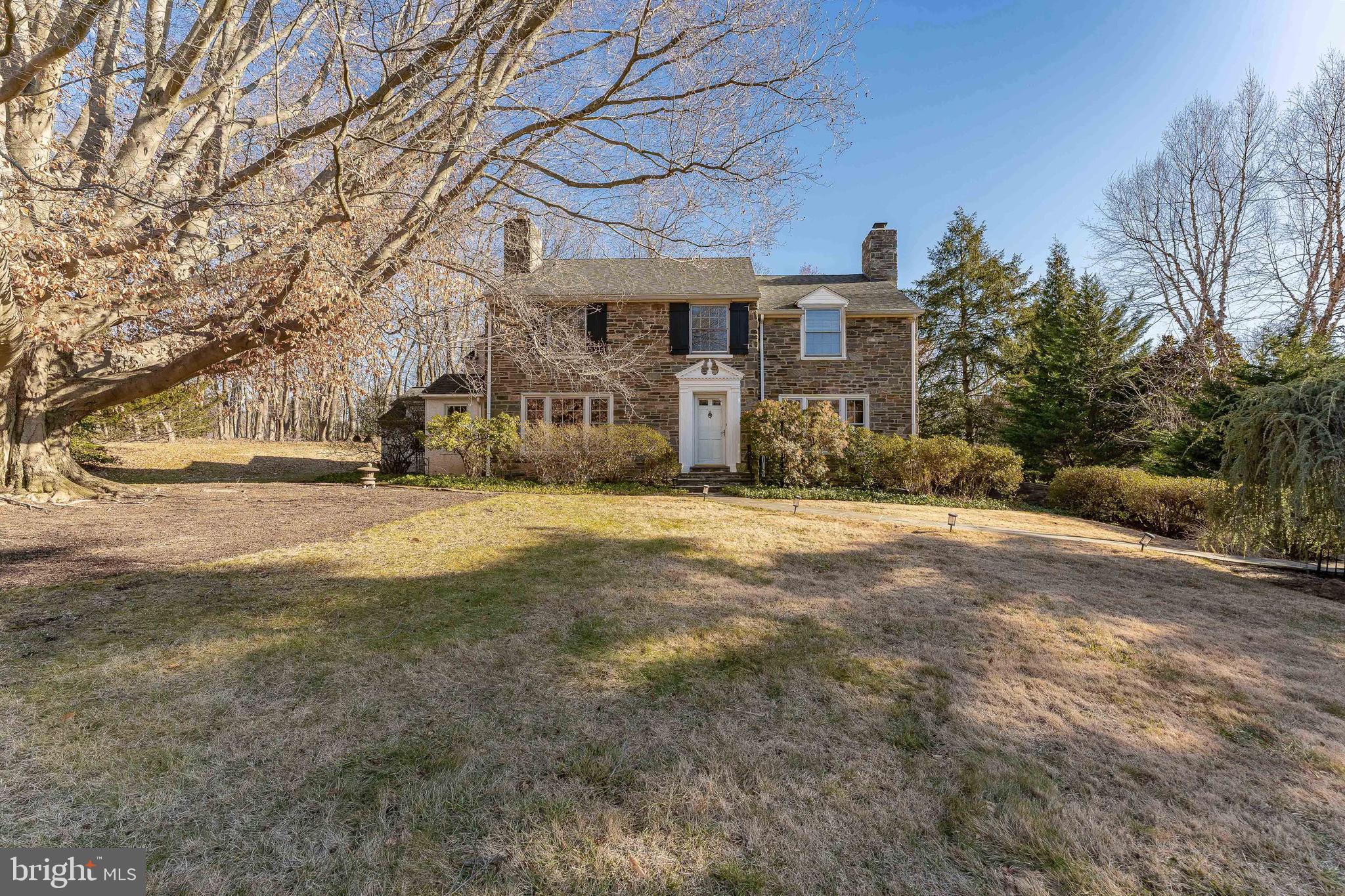 Welcome to 249 Bell Road, an elegant 4-bedroom, 2-full and 2-half bath single-family residence set on a private road in Wynnewood. Thoughtfully designed with generous living spaces and timeless finishes, this home offers comfort, functionality, and classic Main Line appeal. A welcoming foyer with hardwood floors sets the tone upon entry, opening to the formal living room featuring hardwood flooring, a wood-mantel fireplace, and French doors that lead to the screened-in porch. The adjoining dining room continues the hardwood floors and showcases a bay window, chandelier, and direct access to the porch—creating a seamless flow for entertaining. The screened-in porch is a true highlight, offering flagstone flooring and a ceiling fan, making it an ideal space for relaxing or hosting guests in every season. A private home office provides a quiet workspace with built-in cabinetry, carpeted floors, and both interior access and a separate exterior entrance. The eat-in kitchen offers a comfortable space for casual dining and is well-appointed with tile floors, built-in cabinetry, granite countertops, a center island, an electric cooktop, double ovens, a Sub-Zero refrigerator, double sink, and a triple window overlooking the backyard. Adjacent to the kitchen, the family room includes carpeted floors, a vaulted ceiling, built-in cabinetry, and sliding doors that open to the flagstone patio and yard—perfect for indoor-outdoor living. Also on the main level is a laundry area with tile floors and a large walk-in shower, along with a powder room finished with limestone floors and a marble vanity. Upstairs, the primary suite offers a peaceful retreat with carpeted floors, two closets, and an en-suite bath featuring marble floors, a walk-in closet, a walk-in steam shower, and two single sink marble top vanities. Two additional bedrooms with carpeted floors provide comfortable accommodations for family or guests. A full hall bath includes tile flooring and a tub/shower combination with a jetted tub. A cedar closet in the hallway offers ideal storage for seasonal or delicate items. The fourth bedroom includes a bonus space and access to the walk-up attic, adding flexibility for future use. A cozy reading nook completes this level, providing a quiet corner to unwind. The finished walk-out lower level expands the living space with a recreation room featuring tile floors—ideal for a media room, home gym, or playroom. This level also includes a powder room, access to the garage, and the home’s utilities.Ideally located near local shopping, dining, and everyday conveniences, with easy access to I-76, this home offers the perfect blend of privacy, space, and accessibility. 249 Bell Road presents a rare opportunity to enjoy gracious living in one of Wynnewood’s most desirable locations.