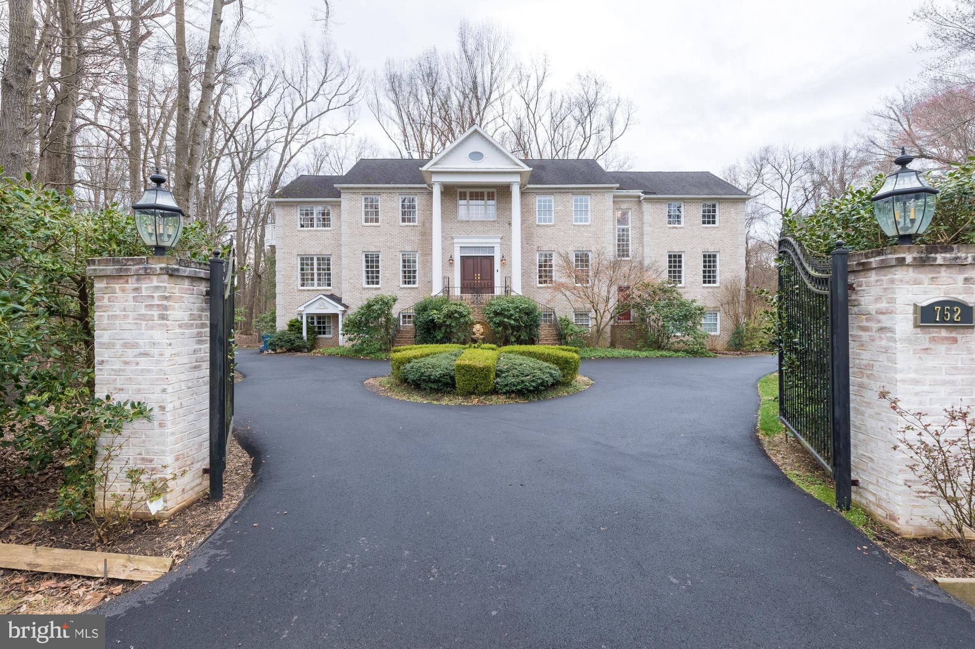 2 Acre, private Estate Home in Georgetown Estates in Cul-De-Sac! Over 8100+ finished square feet all above the ground, optimal for multi-generational living. Gorgeous 2-story foyer with double staircase & marble floor, spacious rooms on Main level, including a bedroom.   Large Sunroom on main level filled with Palladian windows. 2nd Family room w/ fireplace & balcony on Upper level, along with luxury Master Suite with Master bath & 2 Walk in Closets, one the size of a bedroom. 3 additional bedrooms on Upper level, sitting room, & 2 bonus rooms that would be great as Study Rooms! Lower level can be set up for extended family/in-law suite including, 2nd kitchen, dining area, rec room, office, bedroom & multiple extra rooms. Lovely backyard with deck, patio, & fountain. Great for relaxation!! Secluded, yet close to Great Falls Village Center, Great Falls Swim & Tennis Club, Library, & DC Georgetown. 5 Car Garage.