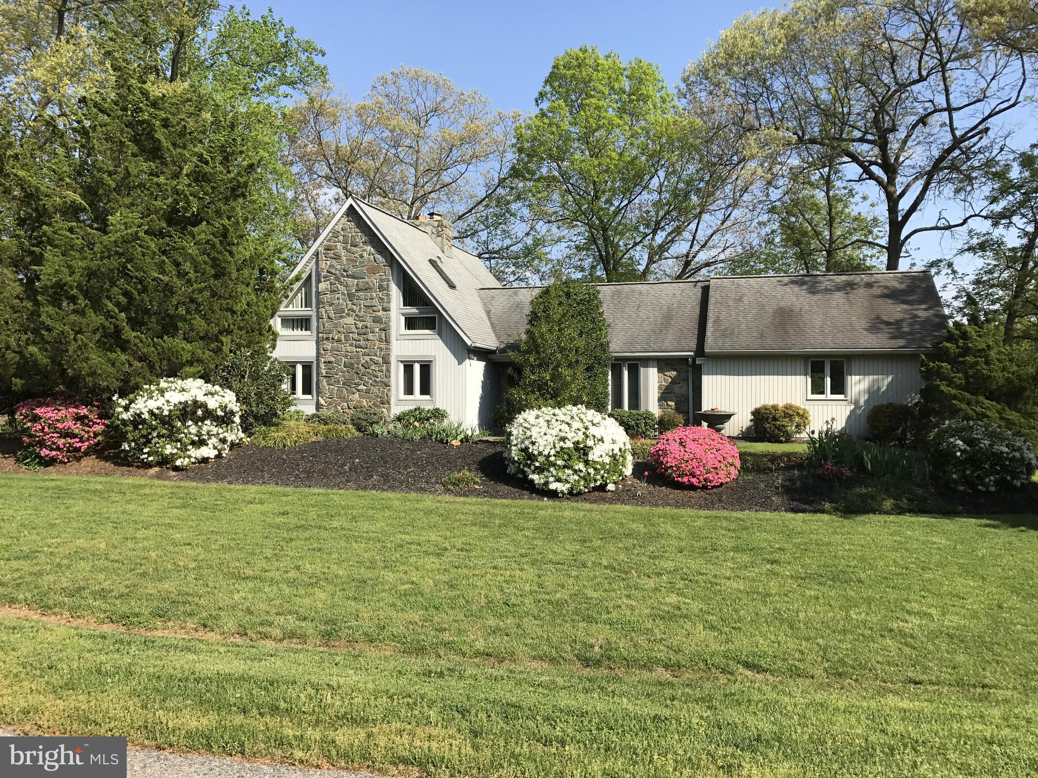 Nestled on 8 sprawling acres, this magnificent Estate is truly one of a kind! A property that offers the perfect blend of luxury and functionality. Only 20 minutes to Annapolis, 25 minutes to Washington D.C. and 35 minutes to Baltimore. Country living secluded and peaceful, yet minutes from all amenities and many major highways. This exclusive community of custom homes, each situated on over 2 acres, exudes a sense of serenity and privacy in a very tranquil neighborhood. Boasting two spacious primary suites and one additional large bedroom, 5 1/2 baths, 4 walk-in closets, and two gourmet eat-in kitchens, complete with granite countertops, stainless steel appliances (including a Jenn-Air cooktop & a double wall oven), tile floors & abundant cabinetry. Four additional rooms offer a rich mahogany decorator wood paneled home office, a spacious loft/multipurpose room complete with full private bath and large closet, a 2nd home office with full bath and walk-in closet, and a thoughtfully designed gathering room providing easy access to the numerous patios, decks and pathways. The open floor plan flows seamlessly, from the breathtaking great room with a soaring stone fireplace & hardwood floors, to the gorgeous formal dining room with custom moldings and more hardwood flooring. This home is designed for grand entertaining. Ten double French doors frame the entire back of the home, allowing you an endless portrait of each season's beauty, while two wood burning inserts offer cozy, or romantic winter evenings with their warm glow. This gorgeous property is a horse lover's dream, a gentlemen farmer's paradise or a homesteader's haven. Featuring 8 12x12 stalls, this concrete block & oak board stable includes a separate, yet attached tool shed. Paved & gravel driveways lead to 4 gated & fenced lush pastures and two run-in sheds. Five well fed hydrants are conveniently located about the property. A stream fed pond flows thru three pastures enhancing the picturesque landscape. This Crown Jewel Estate offers ample space for riding & relaxation with numerous flagstone pathways, terraces and two levels of spacious decking! Exquisite & extensive landscaping provide continuous perennial color throughout the seasons. A bubbling waterfall pond and dramatic gazebo add the finishing touches to your entertaining areas. Timeless elegance combined with modern convenience makes this a rare find for the discerning buyers seeking an idyllic countryside retreat.