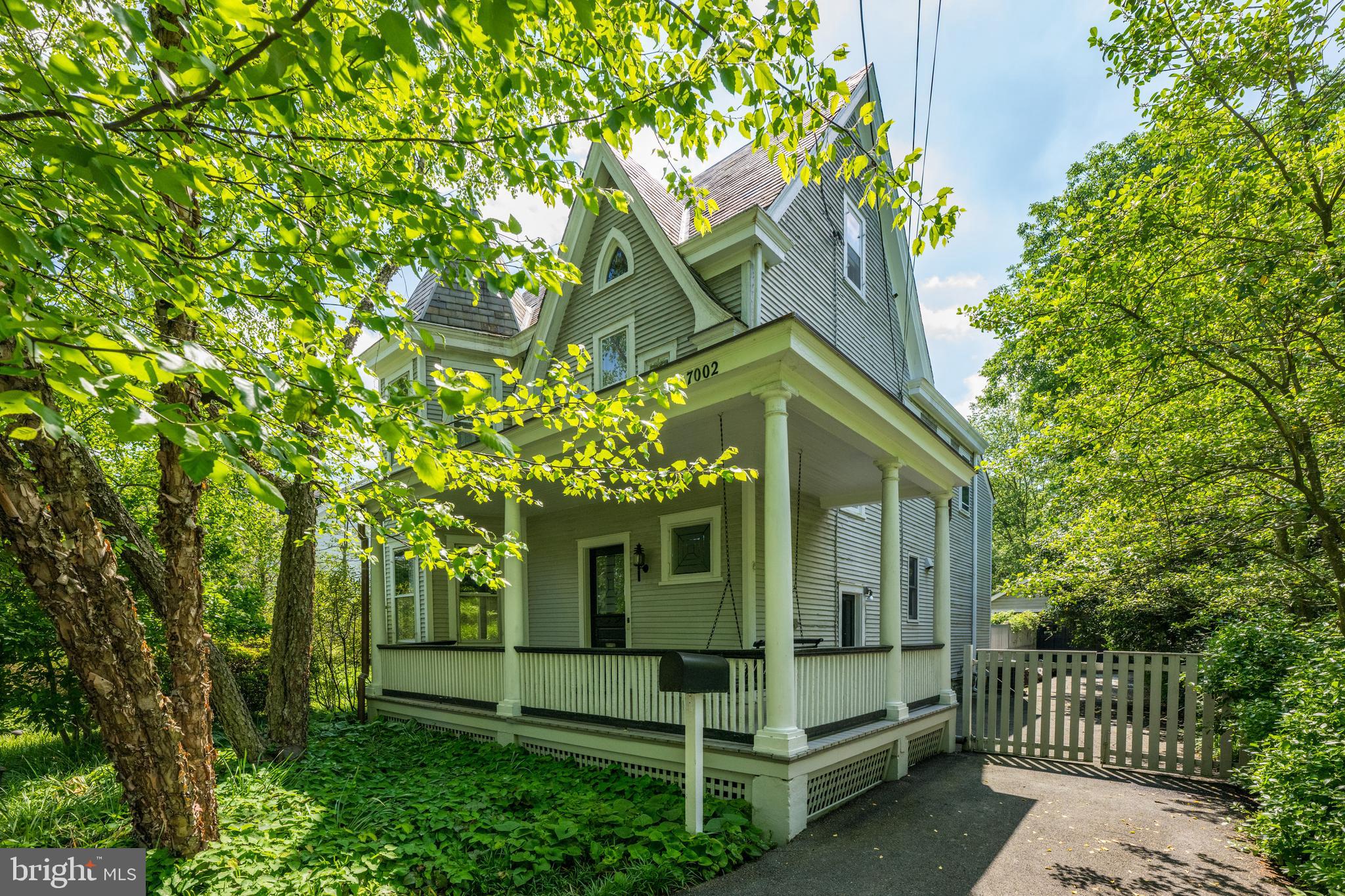Situated on an expansive 20,000 sqft lot in the heart of Chevy Chase, this home has been thoughtfully expanded to include over 5,300 sqft. The main level offers a number of spacious rooms including an updated gourmet, eat-in kitchen, formal living room, dining room with fireplace and built-ins, as well as an oversized family room with fireplace and access to the rear exterior. Rounding out this level is a separate entrance to a main level suite that includes a large bedroom, office/den with built-ins and a full bath. The upper level offers four bedrooms and two full baths including the primary suite with ample closet storage and built-ins, as well as an ensuite bath with double vanity. The third level is spacious and includes an additional two bedrooms and full bath. Rounding out this special home is an expansive, private lot on half an acre with a detached garage. The possibilities are endless on both the interior and exterior of this home!