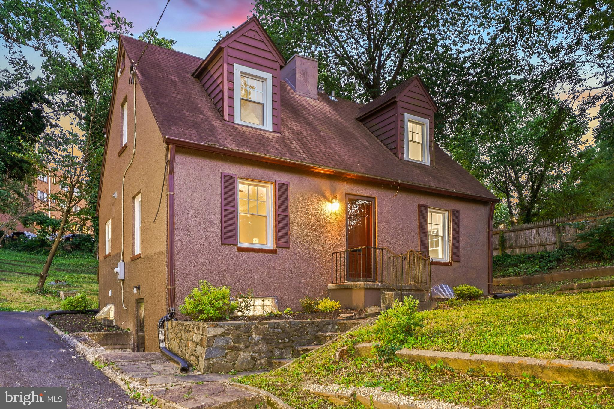 Updated Top to Bottom—Simply Move In! This charming home offers sun-filled rooms, rich hardwood floors, stylishly redesigned bathrooms, replacement windows, and a standout quartz kitchen—all spread across three finished levels of living space on an impressive 11,730-square-foot lot.

The inviting living and dining room combination features recessed lighting, a fireplace, and French doors leading to the new rear deck. Adjacent to the living room, the bright chef’s kitchen is thoughtfully designed with exquisite quartz countertops, Samsung stainless steel appliances (with a Maytag dishwasher), soft-close cabinetry, a gas range with a built-in griddle, and 12-inch tile flooring. The kitchen sink overlooks scenic views of the backyard and deck.

The main level includes an inviting bedroom or office with crown molding and a convenient powder room. Upstairs, you’ll find two generously sized bedrooms, two renovated full baths, and a charming landing area. The primary bedroom features wood flooring, dual closets, and a private en-suite bath with a walk-in shower.

The finished lower level provides flexible living space, including a family room / fourth bedroom with tile flooring and overhead lighting, a bonus room with a wet bar, a beautifully appointed bathroom, and a laundry area. The basement includes a mini kitchenette, bathroom, and separate entrance—making it ideal as a rental unit or an in-law apartment.

Perched on a hill, the home sits on a deep lot featuring an expansive backyard, a deck for entertaining, a shed for additional storage, and a private driveway. The outdoor space offers a tranquil retreat with plenty of room to play, entertain, and unwind.
Located in the Blair neighborhood of Silver Spring, this home offers the perfect blend of peaceful residential living and urban convenience. Enjoy a welcoming community atmosphere with easy access to Sligo Creek Trails, community parks, shopping, dining, and entertainment in both Downtown Silver Spring and Takoma Park. Just 1.0 mile from the Takoma Metro Station and close to multiple bus lines. 514 Silver Spring Avenue is a completely renovated Cape Cod just steps from parks, trails, schools, restaurants, shops and transit!