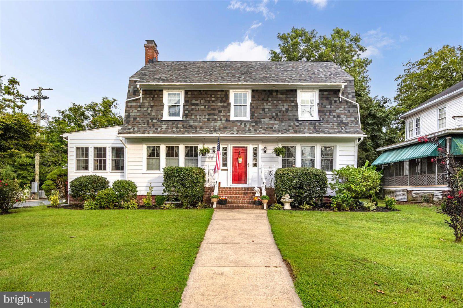 Beautifully maintained, move-in ready, and turnkey, this Dutch Colonial historic home on the National Register of Historic Places combines timeless character with the freedom to personalize without local historic district restrictions and with no HOA. Extensive upgrades provide peace of mind, including a NEW 2023 roof with 47-year warranty, dual high-efficiency heat pumps under warranty, updated plumbing and electrical, 39 replacement double-hung windows, oil boiler backup, and a full dry basement.

The grand center hall foyer showcases original hardwood floors, a staircase, Craftsman trim, French doors, glass doorknobs, crown molding, and cast-iron radiators. Three sets of French doors create seamless flow throughout the main level. Gather in the living room around the wood-burning fireplace, relax on the window seat, or use the sunroom as a home office, remote-work space, flex room, or additional living area. The formal dining room offers Craftsman corner cabinetry and an elegant chandelier. The updated chef's kitchen features custom cabinetry, breakfast bar, and breakfast nook.

This home offers 3 bedrooms, 2.5 baths, including a convenient main-level powder room, and second-floor laundry. The primary suite features a private bath with jetted soaking tub and separate shower. A partially finished walk-up attic offers bonus space and storage. With major infrastructure improvements already completed, this home is ready for you to enjoy.

Designed for outdoor living and outdoor entertaining, the screened porch overlooks the fenced backyard. Mature landscaping, a storage shed, and an Amish-built garage with remote opener add convenience.

Walk one block to downtown restaurants, shops, festivals, farmers markets, and community events. The Pocomoke River, public docks, boat slips, Cypress Park, scenic riverfront walking trail, pickleball courts, tennis courts, concerts, and outdoor recreation are moments away. Minutes to Ocean City, Chincoteague Island, Assateague National Seashore, Berlin, and the Atlantic Coast. Convenient to Washington DC, Baltimore, Philadelphia, New Jersey, and New York, offering historic charm, coastal recreation, walkability, and outstanding value compared to many higher-priced coastal and metropolitan markets. Simply move in, unpack, and breathe. Private in-person and virtual tours available.