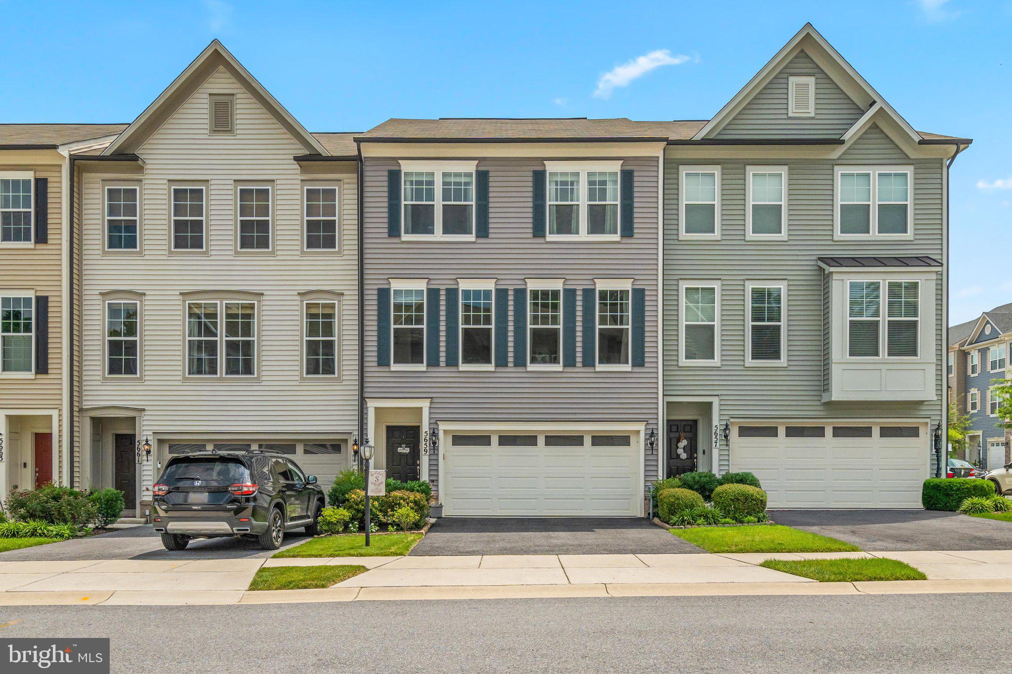What makes this Tallyn Ridge listing better than the others on the market? I'm glad you asked!  This Miller and Smith townhome added a 4th bedroom on the main level while most models in this neighborhood stop at three. Option to upgrade with a fireplace in the Living Room? Oh yeah, they did that. Engineered hardwood floors run through the entire first and second floor with staircases and upstairs hallway included, so there's not a single stretch of carpet interrupting the flow.  Need to unwind outside? You've got three ways to do it, your call: a patio off the main floor into the fenced in backyard, and upstairs, a deck that's been upgraded so half of it lives under a screened-in porch (shade and bugs-be-gone) without giving up the open-air half.
The Primary Suite is where this one really sets itself apart. The sellers ditched the standard wire shelving for a full custom closet system by Closets By Design.  Functional, beautiful, and honestly a little enviable. Then there's the En Suite, upgraded tile and a rainfall shower head that makes it hard to finish getting ready in the morning.  And the location does the rest of the selling. Tucked into Tallyn Ridge, you're minutes from the trails at Pinecliff Park and the Monocacy River, with easy access to historic downtown Frederick's shops and restaurants, plus quick commuter routes for anyone heading out of town. The community itself brings mountain views, a pool, a tot lot, and the best neighbors you'll ever meet.  Everything you'd want, right outside your door.