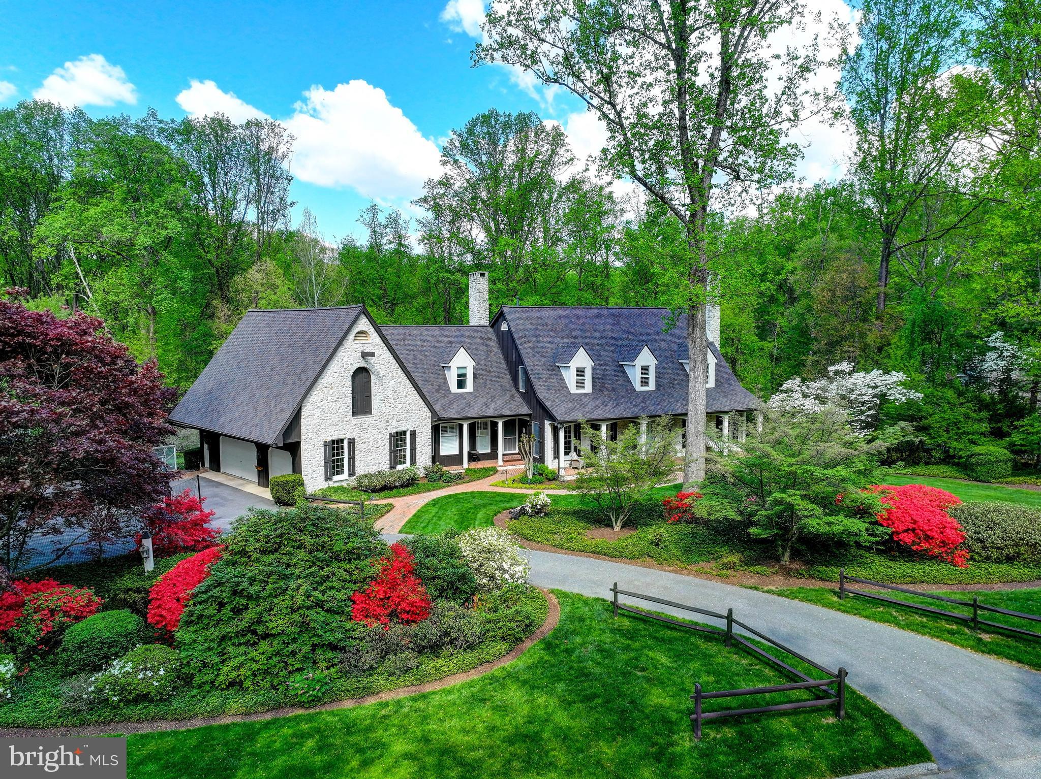 Magnificent Country French Home

Nestled on a beautifully landscaped homesite, this exceptional Country French residence offers timeless architecture, luxurious finishes, and unparalleled craftsmanship throughout. A winding brick walkway welcomes you to this stunning 4-bedroom, 4 full bath, and 2 half bath custom home, complete with a desirable 3-car side-load garage.

Inside, rich hardwood floors, exquisite millwork, elegant archways, plantation shutters, and three fireplaces create an atmosphere of warmth and sophistication. Every detail has been thoughtfully designed to blend refined elegance with comfortable living.

The gourmet chef’s kitchen is appointed with premium Thermador and Sub-Zero appliances, custom cabinetry, and generous gathering spaces, flowing seamlessly into the inviting family room and entertainment areas.

Designed for effortless indoor-outdoor living, the home features an expansive deck, patio, and a spectacular screened porch accessed from both the kitchen and dining room—creating the perfect setting for intimate evenings or grand-scale entertaining.

The extraordinary walk-out lower level rivals the finest luxury retreats, featuring a spacious guest suite, full bath, recreation room, billiards area, custom wet bar, and a dramatic stone fireplace, providing exceptional space for relaxation and hosting guests.

Surrounded by professionally designed landscaping and showcasing remarkable architectural details throughout, this distinguished estate offers a rare combination of luxury, comfort, and timeless Country French charm.