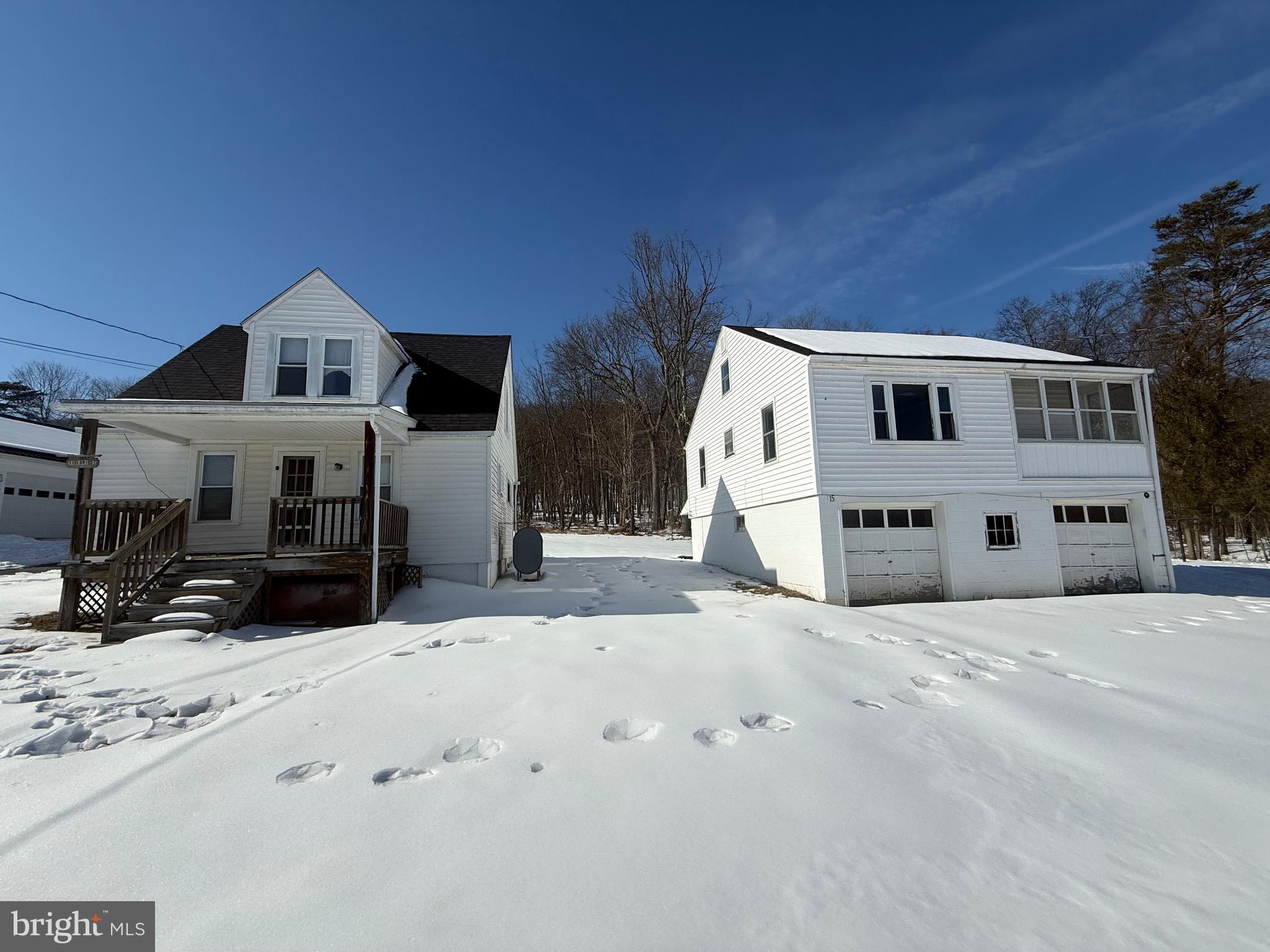 UNIQUE OPPORTUNITY FOR INVESTORS OR HOMEOWNERS WITH BUILT-IN INCOME!  2-STORY, 2 BEDROOM HOME AND 2-CAR GARAGE WITH OVERHEAD 2 BEDROOM APARTMENT.  BOTH STRUCTUES HAVE MAINTENANCE FREE VINYL SIDING, NEW 35 YEAR ARCHITECTUAL SHINGLE ROOFS, PUBLIC WATER & SEPTIC TANKS ON .27/ACRES OF LAND.  2-STORY HOME FEATURES COVERED FRONT PORCH, OIL RADIATOR HEAT (250 GALLON OIL TANK), KITCHEN W OVEN/RANGE & REFRIGERATOR, LIVING ROOM, REPLACEMENT WINDOWS, LAUNDRY ROOM, 2 BEDROOMS, FULL BATH WITH TUB-SHOWER COMBO, NO BASEMENT (CRAWL SPACE), FRONT AND BACK YARD.  2-CAR GARGAGE W OVERHEAD APTS OFFER WOODEN GARAGE DOORS, C-BLK WALLS, CONCRETE FLOOR, (2) STORAGE RMS, UTILITY RM, LAUNDRY RM AND PAVED PARKING AREA.  OVER HEAD APARTMENT CONTAINS 2 BEDROOMS, 1 FULL BATH, KITCHEN W/OVEN-RANGE & REFRIGERATOR, LIVING ROOM, OIL HEAT, ENCLOSED PORCH & AND SMALL EXTRA LOT AREA.  GREAT OPPORTUNITY, INCOME PRODUCING, GOOD LOCATION AND PRICED TO SELL!  WHAT MORE DO YOU WANT!!
