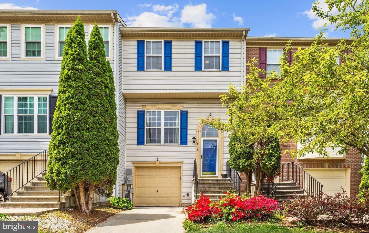This stunning split-foyer townhome showcases soaring windows, sun-drenched interiors, and thoughtfully selected upgrades throughout. From the moment you step inside, you’re welcomed by gleaming hardwood floors, high ceilings, and a spacious, open layout designed for both comfortable living and effortless entertaining. The generous living room flows seamlessly into a separate dining area and an inviting eat-in kitchen featuring new appliances, white cabinetry, ample storage, and direct access to a private rear deck-perfect for morning coffee or evening gatherings.
Upstairs, the expansive primary suite offers abundant closet space and a private full bath. The fully finished lower level includes a laundry area with new washer and dryer, and the potential for a fourth bedroom with a half bath—ideal for guests, a home office, or multi-generational living. A single-car garage with interior access adds everyday convenience.
Recent improvements include fresh paint throughout, brand-new kitchen appliances, and updated laundry machines. The exterior is equally impressive with a private deck and patio, a fenced rear yard backing to evergreen trees for added privacy.