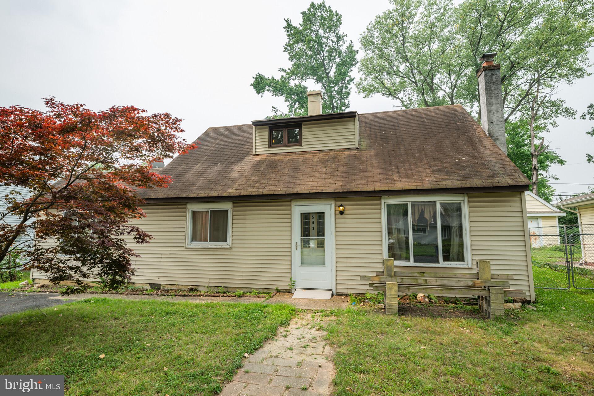 Investor or First-Time Home Buyer Alert! Opportunity awaits with this spacious 3-bedroom, 2-bath Cape Cod with an addition in the quaint Morrisville Borough. Offering flexible living spaces, a large fenced backyard, and the potential for a fourth bedroom, this home is full of possibilities. Step inside to a welcoming family room featuring a hybrid coal/wood-burning fireplace—perfect for cozy evenings—and a large bay window that fills the space with natural light. The adjacent kitchen offers solid wood cabinetry and updated fixtures and flows seamlessly into the formal dining room and spacious living room, creating an ideal layout for everyday living and entertaining. French doors lead to an expansive, private backyard complete with a built-in storage area for bikes, lawn equipment, and outdoor gear. Just off the living room, a versatile bonus room provides the perfect space for a home office, playroom, additional family room, or potential fourth bedroom. The first floor also features a generously sized bedroom with a large closet and a full bathroom with a soaking tub and new toilet, offering the convenience of first-floor living. Upstairs, you’ll find two additional spacious bedrooms and a second full bathroom, providing ample room for family, guests, or hobbies. Outside, the fully fenced backyard is the true highlight of the property, offering endless opportunities for entertaining, gardening, or creating your own private retreat. Whether you’re looking for an affordable place to call home or an investment with great potential, this property offers space, flexibility, and value in a convenient location close to shopping, dining, parks, schools, and major commuter routes. Don’t miss your opportunity to make it your own!