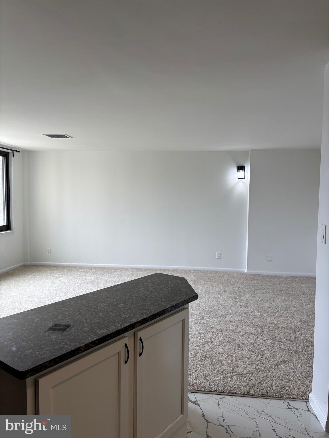 Welcome home to this beautifully updated unit featuring brand-new carpeting throughout, fresh paint, and professional cleaning—making it move-in ready!

The open kitchen boasts new granite countertops and a convenient ledge for barstools, perfect for casual dining. Abundant natural sunlight fills the space, complementing the street-facing view.

The master bedroom offers a walk-in closet with built-in storage, plush new carpeting, and a large window to bring in even more light. Updated fixtures throughout add a modern touch.

Enjoy access to fantastic community amenities, including a pool, tennis courts, laundry facilities, and a 24-hour concierge. Conveniently located within walking distance to Northwestern High School, PG Plaza Mall, Regal Movie Theatre, and more!

📍 Don’t miss out on this gem—schedule your tour today!