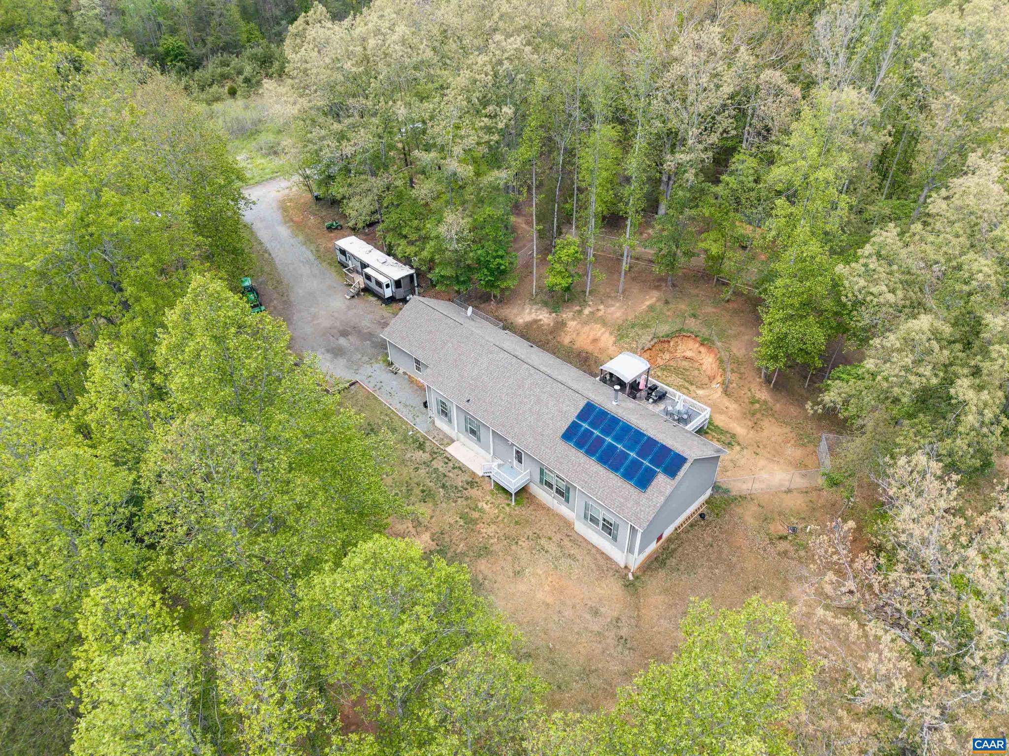 OPEN SUNDAY  Noon-2:00   5/30/26Just Listed - Rare opportunity to own a unique 3-parcel mini farm totaling over 10 acres, spanning both Albemarle and Orange County ? offering flexibility, privacy, and endless potential. Several fenced areas are mini farm with run in sheds and other buildings  a rare chance to have your animals.  The main residence sits on 4.89 acres in Orange County, complemented by two additional parcels (1.16 & 4.28 acres in Albemarle County) ? including over 5 acres of wooded land ideal for recreation, hunting,  All parcels are deeded separately and being sold together, creating a truly versatile investment.This well-appointed home offers over 2,100 finished square feet, featuring a spacious gourmet kitchen, open great room, and a private king-sized primary suite with walk-in shower. Designed for efficiency &sustainability, the property includes solar energy and a water treatment system, helping reduce utility costs while supporting a self-sufficient lifestyle. Whether you're dreaming of horses, chickens, sheep, dogs, or simply wide-open space, this property delivers the freedom to live your way ? all while enjoying convenient access to Charlottesville, Gordonsville, and Northern Albemarle County.,Fireplace in Great Room