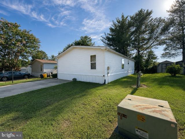 Welcome to this spacious double-wide manufactured home in Boone’s Estates! The bright, open-concept layout offers a seamless flow between the living, dining, and kitchen areas—perfect for everyday living and entertaining. Large windows fill the home with natural light, while the stone fireplace adds warmth and character to the main living space. The kitchen features abundant wood cabinetry, generous counter space, and an adjoining dining area. The primary bedroom includes a spacious private bathroom with a separate tub and walk-in shower. An additional full bathroom serves the secondary bedrooms. Located in a land-lease community; buyer must obtain park approval.