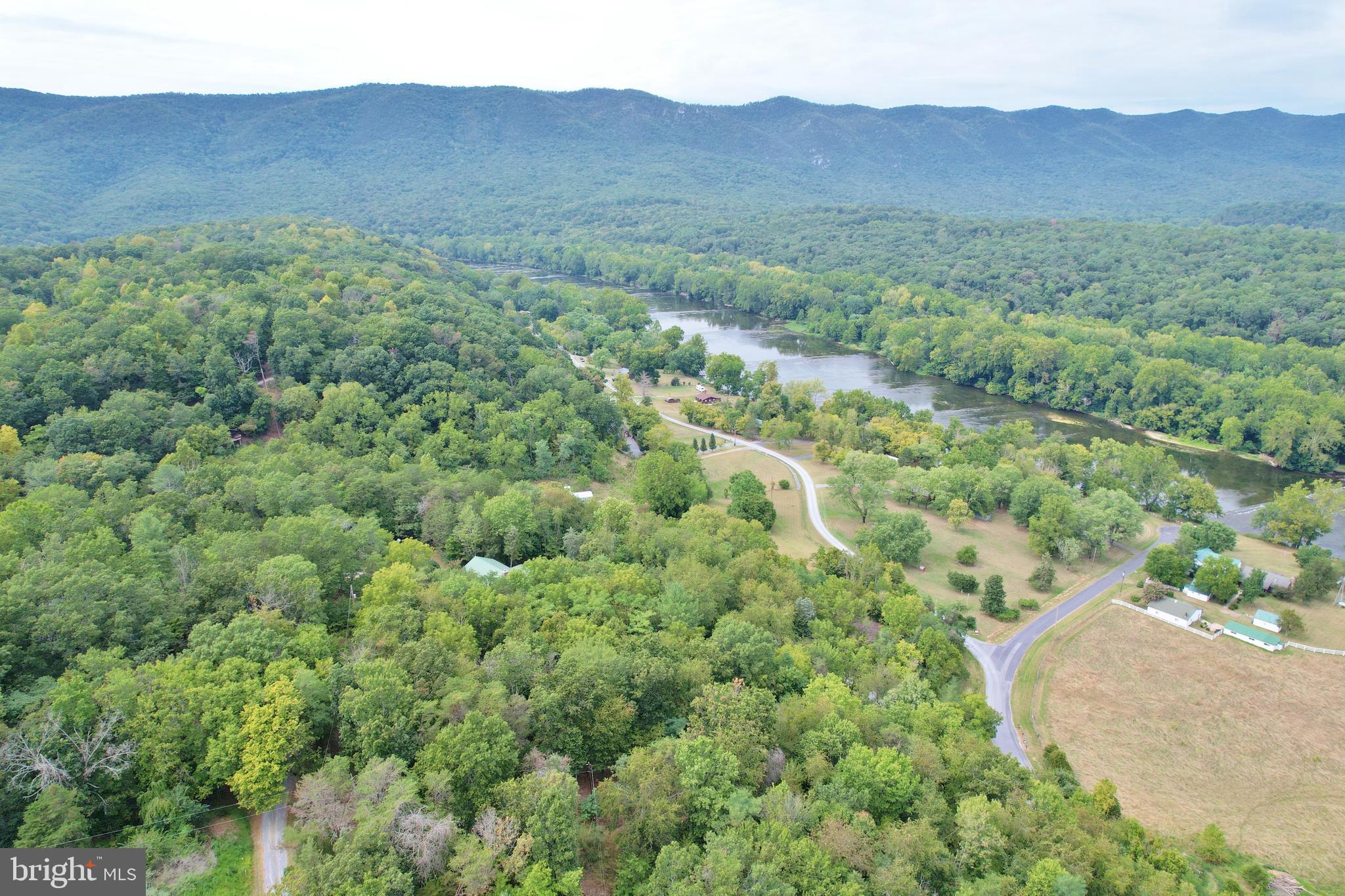 Come see this wooded lot, build your dream vacation home with mountain views and close proximity to the river.  The Shenandoah Ridge Community has private access to the Shenandoah River.  Come enjoy the wildlife, kayaking, fishing, or hiking. The National Park and Forest are nearby, as well as the Luray Caverns, Luray Zoo, and only 8 miles to all Luray downtown has to offer.  Ready to build with a SEPTIC certification letter and a survey of the proposed well, septic and building locations!!  Come with your home plans!