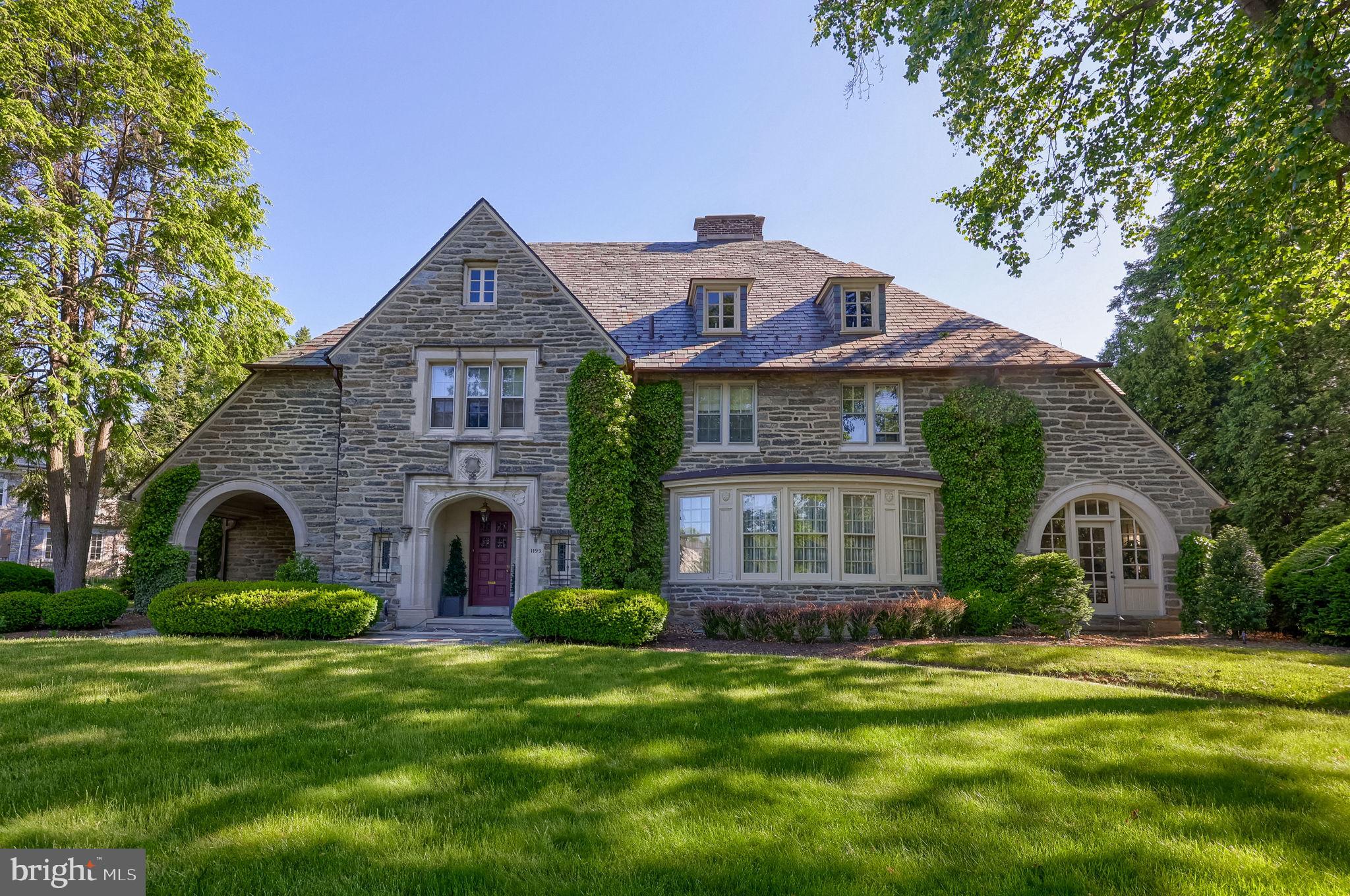 Reintroduced to the market, and more compelling than ever - this is the home Wyomissing has admired for a century.  

Original 1926 castle-stone set at a landmark corner position on the borough's most prestigious boulevard. Elevated by $700,000 in estate-quality upgrades, with every detail curated for a lifestyle of distinction.  

Greet guests in a grand foyer with high ceilings, elegant hardwood floors, and an iron stair railing — a proper introduction to the home’s enduring beauty enhanced by estate-quality improvements throughout.   
   
Entertain in unmistakable style in the Williamsburg-inspired dining room with Thomas Jefferson duplicate built-ins, or delight in the award-winning, epicurean kitchen, featuring a central island, breakfast bar, tray ceiling, dramatic moldings, and a sunlit breakfast room overlooking serene back gardens.  

Bathed in natural sunlight, the inviting sunroom offers sweeping views of the gardens, while the richly paneled den, with original wood ceilings, custom built-ins, and a grand wood-burning fireplace, serves as both a regal retreat and refined gathering place.  

Upstairs, discover a Master Suite sanctuary with a dressing room of custom organizers, a spa-like bath with Whirlpool tub, waterfall faucet, rain shower, and striking marble counters. Secondary bedrooms offer their own character and comforts with dual closets, built-ins, and angled ceilings, while supplemental heat in every bathroom, a second-story sixth bedroom/multi-purpose room, floored attic, and large laundry blend convenience with luxury.  

Masterfully reimagined to surpass every expectation of luxury and entertainment, the lower level unveils a spectacular family suite with stunning, custom Schubert built-ins, a designer wet bar, cleverly concealed office, and a gym featuring mirrored ceilings. A full tiled bath and additional laundry bring effortless convenience, making both special gatherings and casual evenings feel truly legendary.  

This home stands as a testament to legacy and hospitality at the highest level. This is more than an opportunity; it’s an invitation to steward a landmark of Wyomissing — where your family’s memories become woven into the fabric of local history.