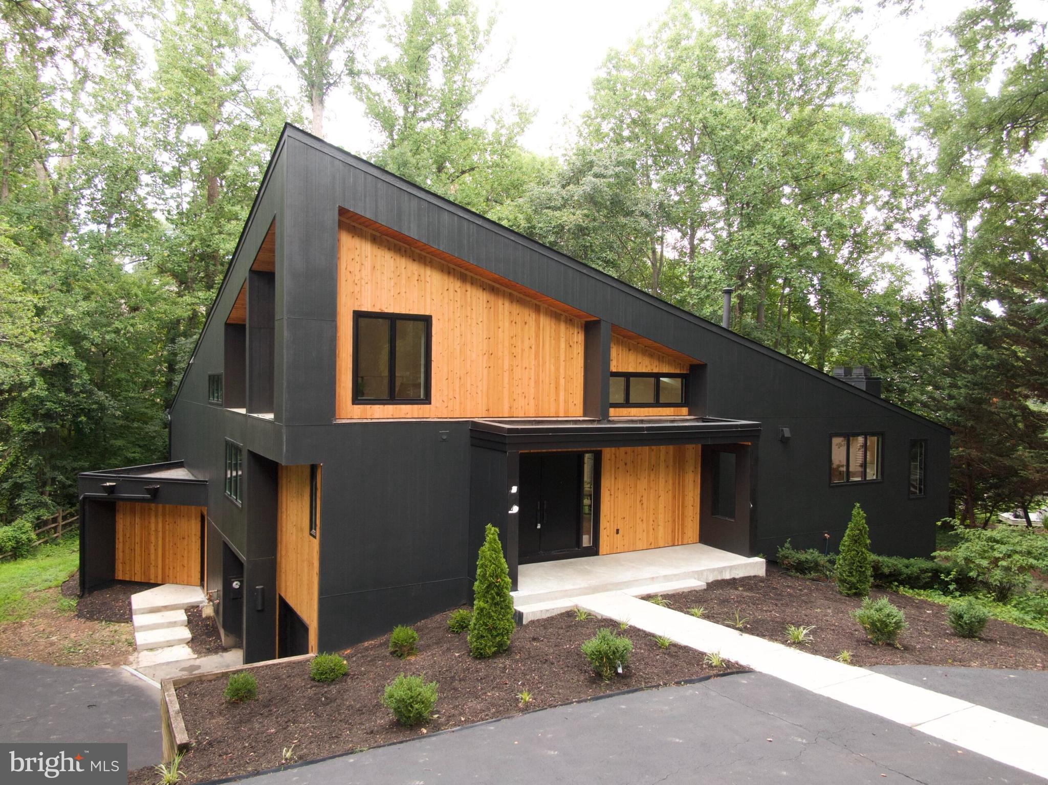 Discover a rare opportunity to own a fully renovated contemporary single-family home steps from Lake Newport in Reston, Virginia. Perfectly positioned just moments from the water, this architectural residence offers approximately 4,400+ square feet of thoughtfully designed living space, blending modern luxury with one of Northern Virginia's most desirable outdoor lifestyles.

Dramatic ceilings soaring nearly 20 feet, expansive walls of glass, and an oversized wraparound deck capture tranquil wooded surroundings and beautiful seasonal views of Lake Newport, creating seamless indoor-outdoor living.

Completely reimagined with exceptional craftsmanship, the home features a stunning chef's kitchen anchored by a 10-foot waterfall island, custom cabinetry, premium JennAir appliances, quartz countertops with a full-height quartz backsplash, designer lighting, and an open-concept floor plan ideal for entertaining. Additional upgrades include 7.5-inch wide-plank hardwood flooring, spa-inspired designer bathrooms, oversized walk-in closets with custom organization, and a finished 2-car garage. 

Located in the heart of Reston, residents enjoy direct access to Lake Newport, scenic walking and biking trails, parks, tennis courts, pickleball courts, pools, and the extensive Reston Association amenities. This exceptional location is just minutes from Reston Town Center, the Wiehle-Reston East and Reston Town Center Silver Line Metro Stations, Wegmans, Reston National Golf Course, and countless restaurants, shopping, and entertainment options.

Commuters will appreciate convenient access to the Dulles Toll Road (Route 267), Route 7 (Leesburg Pike), Fairfax County Parkway, Tysons Corner, Dulles International Airport, and downtown Washington, D.C.

Whether you're searching for a luxury home near the water, a modern home in Reston, or a contemporary lake-view property with exceptional design, this residence offers a truly one-of-a-kind lifestyle , truly a hidden gem in Northern Virginia's premier lake communities! **Deadline July 18th at 5pm**