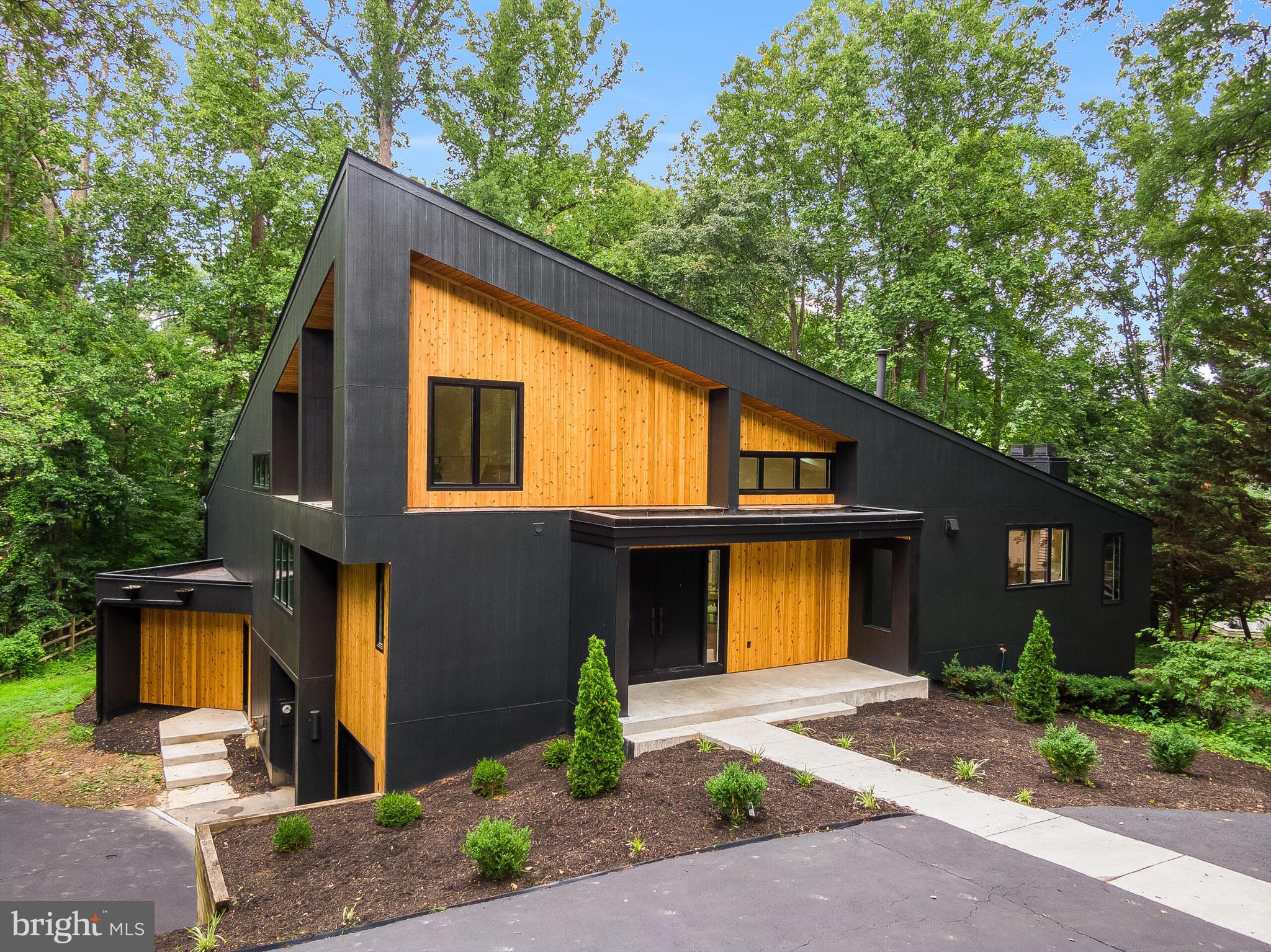 Discover a rare opportunity to own a fully renovated contemporary single-family home steps from Lake Newport in Reston, Virginia. Perfectly positioned just moments from the water, this architectural residence offers approximately 4,400+ square feet of thoughtfully designed living space, blending modern luxury with one of Northern Virginia's most desirable outdoor lifestyles.

Dramatic ceilings soaring nearly 20 feet, expansive walls of glass, and an oversized wraparound deck capture tranquil wooded surroundings and beautiful seasonal views of Lake Newport, creating seamless indoor-outdoor living.

Completely reimagined with exceptional craftsmanship, the home features a stunning chef's kitchen anchored by a 10-foot waterfall island, custom cabinetry, premium JennAir appliances, quartz countertops with a full-height quartz backsplash, designer lighting, and an open-concept floor plan ideal for entertaining. Additional upgrades include 7.5-inch wide-plank hardwood flooring, spa-inspired designer bathrooms, oversized walk-in closets with custom organization, and a finished 2-car garage. 

Located in the heart of Reston, residents enjoy direct access to Lake Newport, scenic walking and biking trails, parks, tennis courts, pickleball courts, pools, and the extensive Reston Association amenities. This exceptional location is just minutes from Reston Town Center, the Wiehle-Reston East and Reston Town Center Silver Line Metro Stations, Wegmans, Reston National Golf Course, and countless restaurants, shopping, and entertainment options.

Commuters will appreciate convenient access to the Dulles Toll Road (Route 267), Route 7 (Leesburg Pike), Fairfax County Parkway, Tysons Corner, Dulles International Airport, and downtown Washington, D.C.

Whether you're searching for a luxury home near the water, a modern home in Reston, or a contemporary lake-view property with exceptional design, this residence offers a truly one-of-a-kind lifestyle , truly a hidden gem in Northern Virginia's premier lake communities! **Offer Deadline July 18th at 5pm**