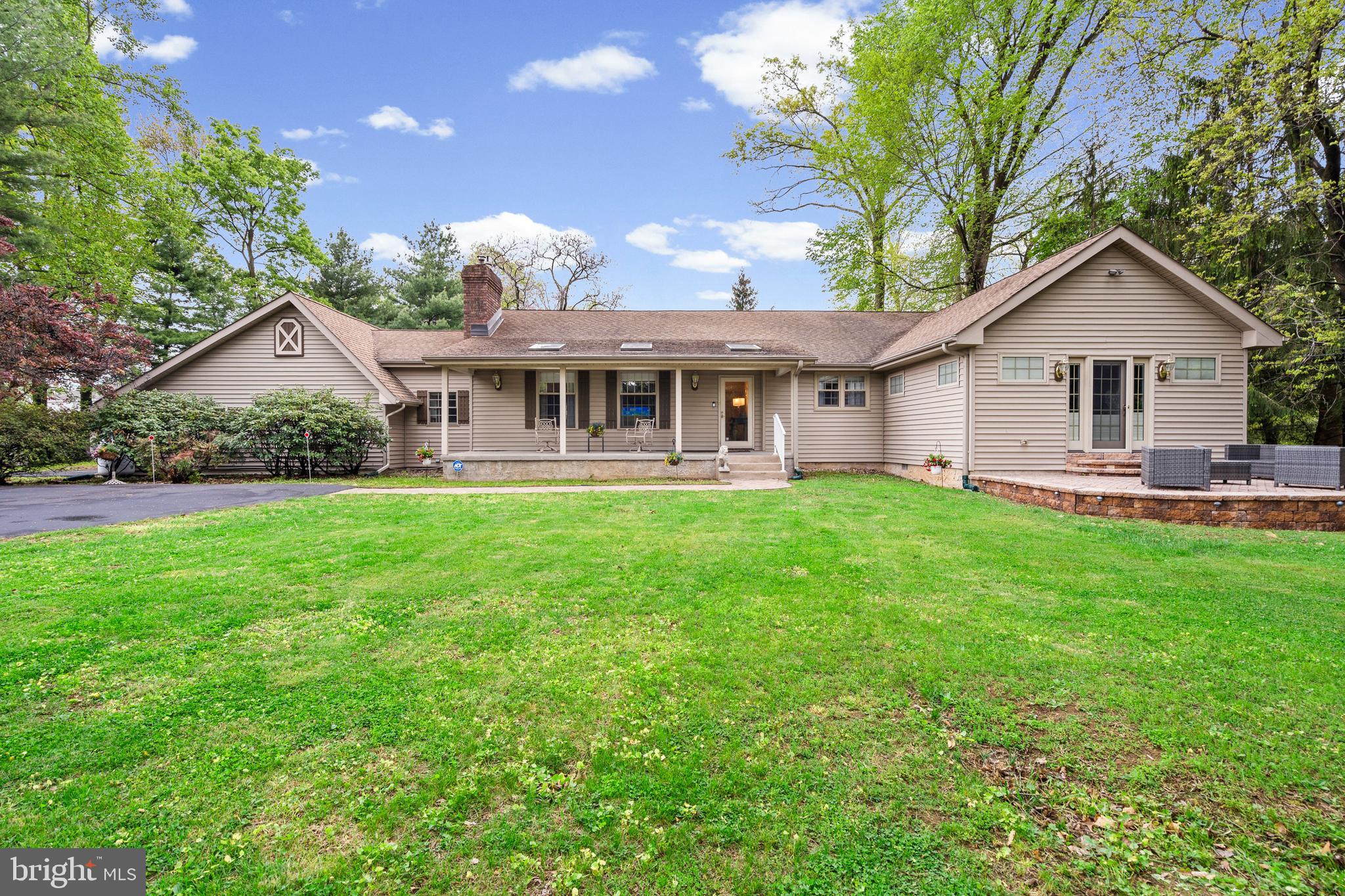 Welcome to 612 Double Woods Road ,a refined one floor living in this exceptional executive rancher, ideally situated on a quiet dead end street and set on a picturesque 1.23 acre lot. Thoughtfully expanded and impeccably maintained, this home blends timeless design with high end upgrades throughout. Step onto the inviting covered front porch and into a warm elegant interior featuring a spacious living room with a gas fireplace, perfect for relaxing or entertaining. The layout flows effortlessly into the show stopping kitchen addition-truly the heart of the home. This extraordinary space is flooded with natural light from a full wall of sunburst Pella windows with built in blinds, creating a bright and airy atmosphere. The kitchen is outfitted with custom cabinetry, Corian countertops and integrated dual sinks including a convenient island sink, a massive center island with seating for 2, wine refrigerator, premium appliances including Viking wall oven and microwave ,heated tile flooring, tiled back splash, and abundant high hat lighting. French doors lead seamlessly to the rear paver patio ,ideal for effortless indoor-outdoor entertaining. A standout feature is the luxurious primary suite addition offering a private retreat with vaulted ceiling, oversized walk in closets, and french doors to a raised paver patio. The spa inspired ensuite bath boasts heated floors, beautifully tiled walls and flooring, and an expansive walk in shower with a built in seating area. The main level includes three additional generously sized bedrooms, a well appointed hall bath, and a convenient laundry room, all designed for comfortable everyday living. Additional highlights include a side entry 3 car garage and a full unfinished basement offering incredible storage or future finishing potential, plus a a small unfinished office space perfect for working from home. From the peaceful setting to the high end finishes and thoughtful layout ,this remarkable home offers the perfect combination of luxury, comfort and privacy. A rare opportunity to own a truly exceptional ranch style residence .