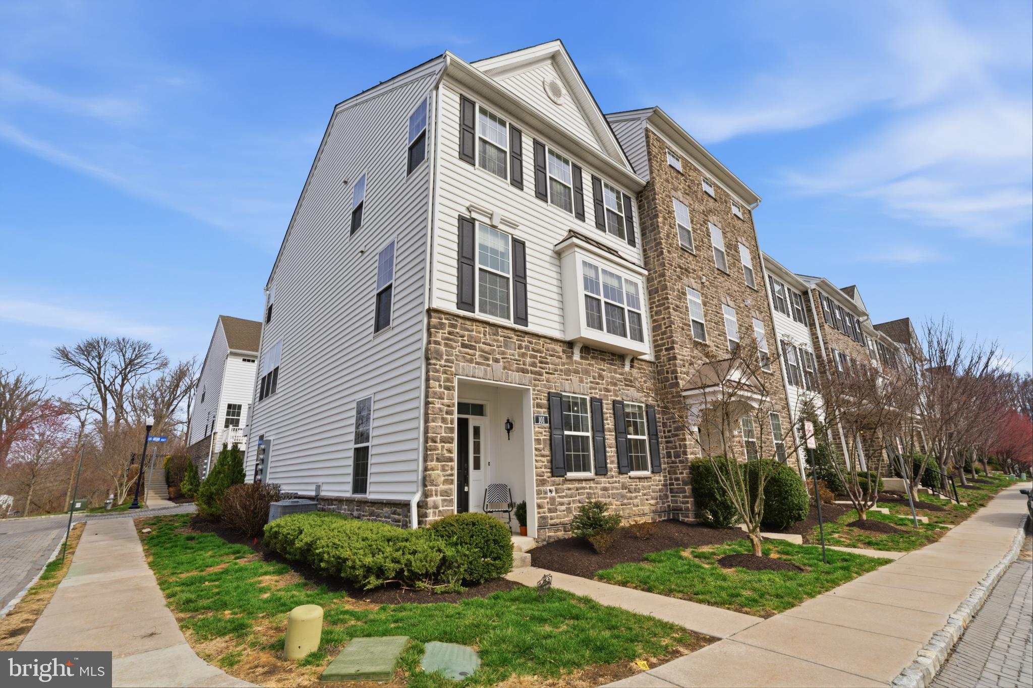 Wow!  It doesn't get more custom, modernized or maximized than this!  Welcome to 101 Murray Ln a light and bright end unit in the coveted Ravenscliff community  in Media!  This incredible community offers the best location for easy access to downtown Media, The Main Line, Philadelphia and all major highways.  The current owners have loved and customized this home since it was built back in 2017 and you will adore all they've done.  Enter the home into a large and welcoming mudroom with custom trim work, coat closet, wallpaper and tiled flooring.  The ground level has a large room, currently being used as the 4th bedroom with its large front windows and plush carpeting.  This space also makes a wonderful office space or another rec room.  There is a half bath on the ground level for convenience and access to the large garage, perfect for parking in, exercise or for tons of storage space!  Head upstairs to the main level and you'll be in awe of how warm and inviting it is!  The gorgeous kitchen has white shaker cabinets with crown molding, stainless steel appliances to include a gas cooktop, tiled backsplash, gorgeous hardwood floors and granite countertops and center island for seating.  Enjoy the breakfast room space with a slider leading out to the back deck, the perfect spot for an evening cocktail or to grill up dinner.  The great room space is large , with a gas fireplace, a wall of windows, board and batten trim details and the gorgeous hardwoods!  The formal living room and dining room combo towards the front of the home is gorgeous!  Picture frame moldings, wallpaper, exceptionally unique lighting and furniture placement make this space so incredible.  The 2nd half bath is perfectly located along with a large pantry closet.  The entire main level has hardwood floors, making it so easy to decorate.  Head up to the 2nd floor.  You'll fall in love even more!  The primary suite has 2 enlarged walk- in closets (larger than other homes in Ravenscliff), a gorgeous bedroom space with vaulted ceiling and a modernized bath with large walk-in shower.  The 2 additional bedrooms are nice in size as well, offering plenty of closet space with custom closet built-ins.  The laundry is located on the 2nd floor for convenience! Even that space was customized with cabinetry and wallpaper!  The touches throughout this home are what make it so special as well as the upgrades done during the building process.  There is nothing to do here but move right in!  It's stunning.  Take advantage of the location and all it offers.