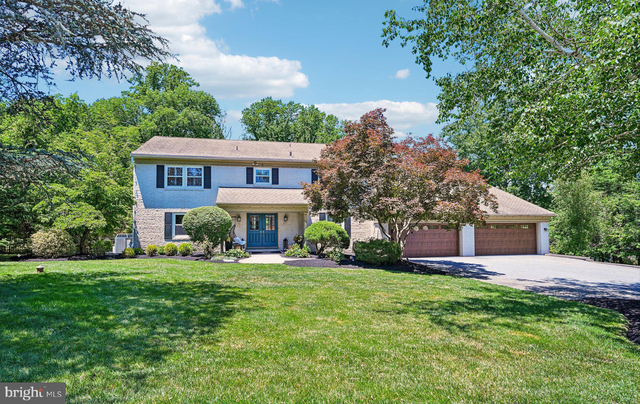Welcome to 99 Springton Lake Road in Upper Providence Township. Nestled on one of the area's most picturesque streets just moments from the scenic Springton Reservoir, this stunning home offers over 5,000 square feet of beautifully maintained living space, 5 bedrooms, 5 full bathrooms, and 3 half bathrooms within the award-winning Rose Tree Media School District. Set on a beautiful, professionally landscaped lot, this property was designed for both comfortable everyday living and exceptional entertaining. The backyard is a true private oasis featuring a heated in-ground pool with attached spa, expansive deck with multiple seating and dining areas, and mature landscaping that creates a peaceful, resort-like setting.
Inside, quality craftsmanship and thoughtful design are evident throughout with detailed millwork, solid core doors, generous room sizes, and hard wood floors throughout. The updated kitchen is the heart of the home and features custom Kountry Kraft cabinetry, marble countertops, Thermador stainless steel appliances, subway tile backsplash, artisan lighting, and a built-in banquette overlooking the backyard. The kitchen opens seamlessly to the family room with a wood-burning fireplace, while formal living and dining rooms provide additional space for entertaining. One of the most unique features of this home is the rarely offered main-level in-law, au pair, or multi-generational suite complete with its own kitchen, living room, 2 bedrooms (one ensuite with private bathroom), half bathroom with laundry area, private entrances, and separate utilities. Offering endless flexibility, this space is ideal for extended family, guests, or a private home office setup.
The second floor is highlighted by a spacious primary suite with gas fireplace, large dressing room and walk-in closet, and a spa-inspired bathroom with soaking tub and oversized shower. There are two additional large bedrooms that share a hall bathroom with attached second-floor laundry. The finished walkout lower level adds even more living space with room for recreation, fitness, entertaining, and storage, including a custom bar area, built-in cabinetry, workshop space, and powder room.
Completing the property is a four-car attached garage, extensive hardscaping, numerous updates throughout, and an unbeatable location just minutes from the shopping and dining of Newtown Square, Ellis Preserve, downtown Media, Ridley Creek State Park and major commuting routes. Meticulously maintained and thoughtfully updated, 99 Springton Lake Road offers the space, flexibility, and outdoor amenities today's buyers are searching for. This property is not to be missed!