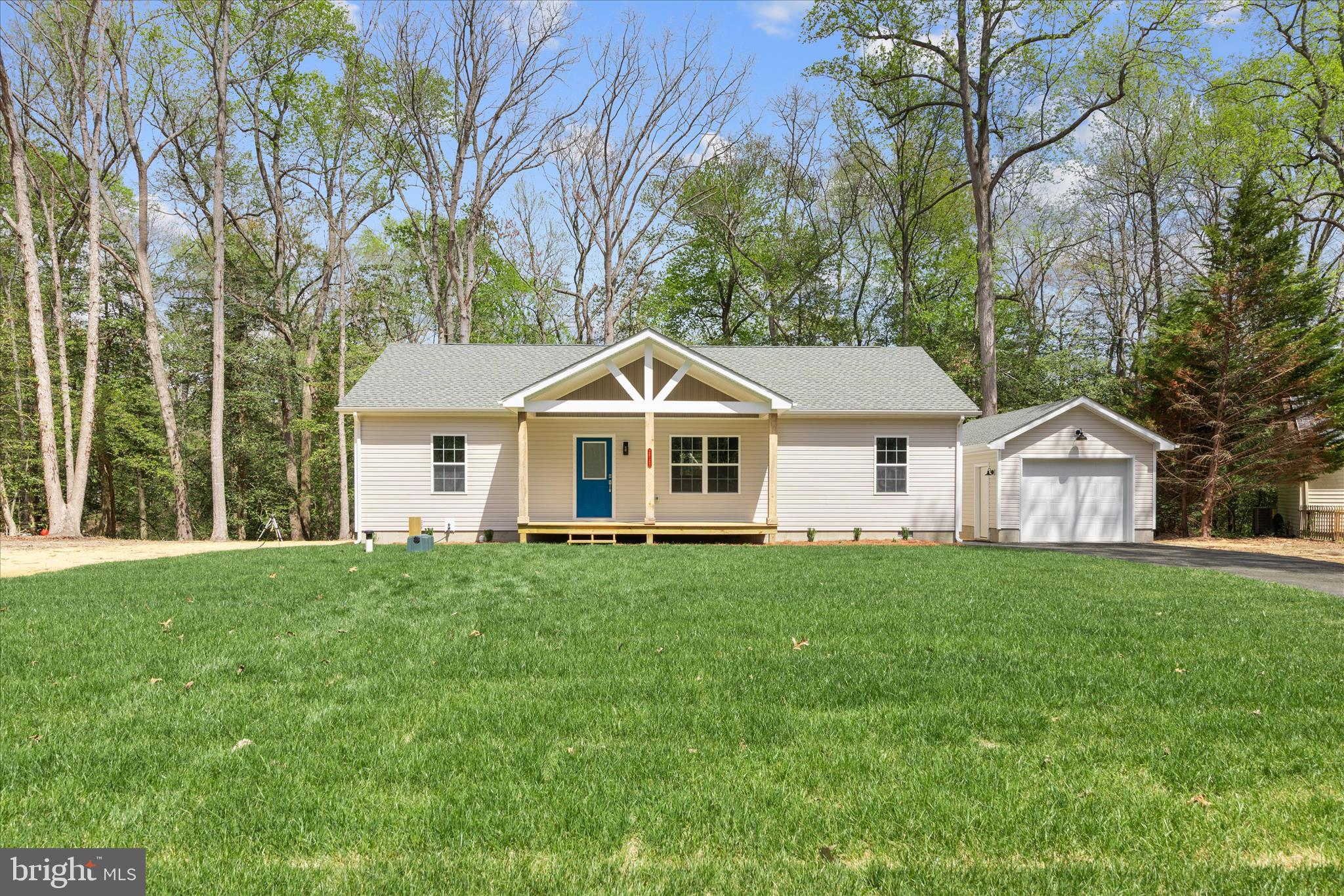 Back on the Market and Move-in Ready! This charming one-story new construction home is tucked away on a peaceful, one-acre wooded lot in the desirable Pine Lane subdivision. Backing to a tranquil pond and surrounded by mature trees, the setting offers exceptional privacy and a true sense of serenity. Inside, the open-concept layout features a spacious living room that seamlessly flows into the kitchen—perfect for everyday living and entertaining. The home offers three comfortable bedrooms and two full bathrooms, each showcasing tiled showers and granite countertops. Natural light fills the space, highlighting LVP flooring throughout. From the kitchen, a sliding glass door leads to the back deck and backyard, creating an ideal spot to relax and enjoy the natural surroundings. Additional features include a welcoming front porch, a laundry room/pantry, a paved driveway, and a detached one-car garage. While offering a quiet retreat, the home is conveniently located just 15 miles from the beaches, dining, and charm of Lewes and Rehoboth Beach. Final square footage is approximate..  Don't wait, call for more details today.