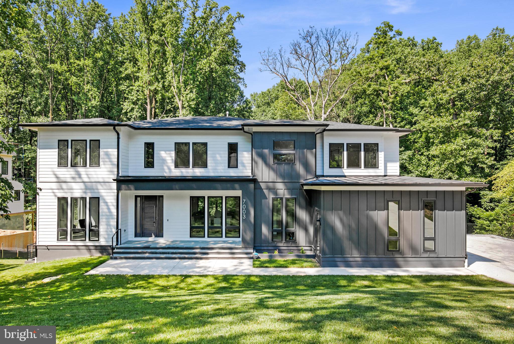 Introducing beautiful new construction in Langley Forest, one of McLean's most esteemed neighborhoods. Nestled on a cul-de-sac, this home exudes class and sophistication. It features a gourmet kitchen, complete with an additional, second prep kitchen, a large walk-in pantry, and a butler's pantry, making it perfect for culinary enthusiasts. The kitchen seamlessly opens to the family room, creating a warm and inviting space. The separate dining room is ideal for elegant dining experiences, and a dedicated office provides a private workspace. In addition, multiple walk-outs provide seamless access to the backyard oasis.  The upper level boasts four bedrooms, including a luxurious owner's suite with a sumptuous bath. The distinctive multi-tiered basement features two additional bedrooms, an exercise room, and an open family room with a fully appointed wet bar, creating an unparalleled living space. The three-car garage leads to a convenient mudroom with a dog shower and an additional washer and dryer. This one-of-a-kind home is designed for making timeless memories and offers a prime location, making it a commuter's dream with easy access to Tysons Corner, Washington DC, and all major commuter routes.