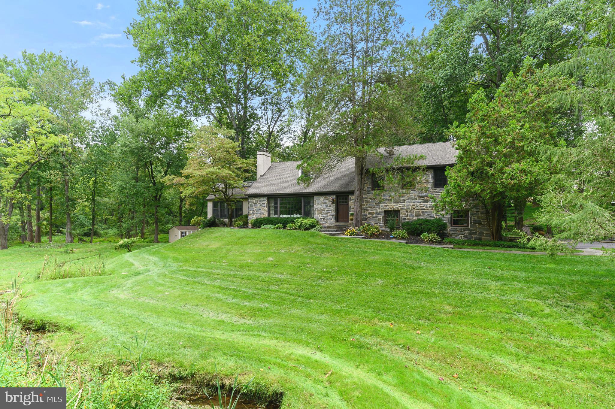 Welcome to 2401 Buttonwood Road! You’ll love this beautiful 5 bedroom, 4.5 bathroom home in the heart of Radnor Hunt - a wonderful two acre property amidst Conservancy Lands in Willistown Township. With a floor plan that flows easily from room to room, this home is larger than it first appears. Enjoy hardwood flooring, beautifully updated kitchen with breakfast area, a convenient home office, and a spacious great room with walls of windows offering wonderful views plus a full bathroom! The living room offers a fireplace with a wood burning insert that flows in to the dining room - perfect for entertaining! Watch TV, play games, or just hang out in the large finished lower level with a full bathroom. The office has an attached powder room and this room could easily be a 5th bedroom.  The upper levels offer a primary suite with a luxurious ensuite bathroom with dual vanity, stall shower, soaking tub and a walk-in closet.  Three additional bedrooms, hall bathroom, and laundry room complete these levels. The large rear deck overlooking woods and stream is the perfect place for morning coffee or evening cocktails! This home sits within award winning Great Valley School District yet just minutes from some of the best private schools in the country. Close to all major roadways, the Philadelphia airport, Paoli train station, and the abundant dining and shopping options of Malvern Borough and Downtown Wayne. Call today to see this magnificent home; it will not disappoint!