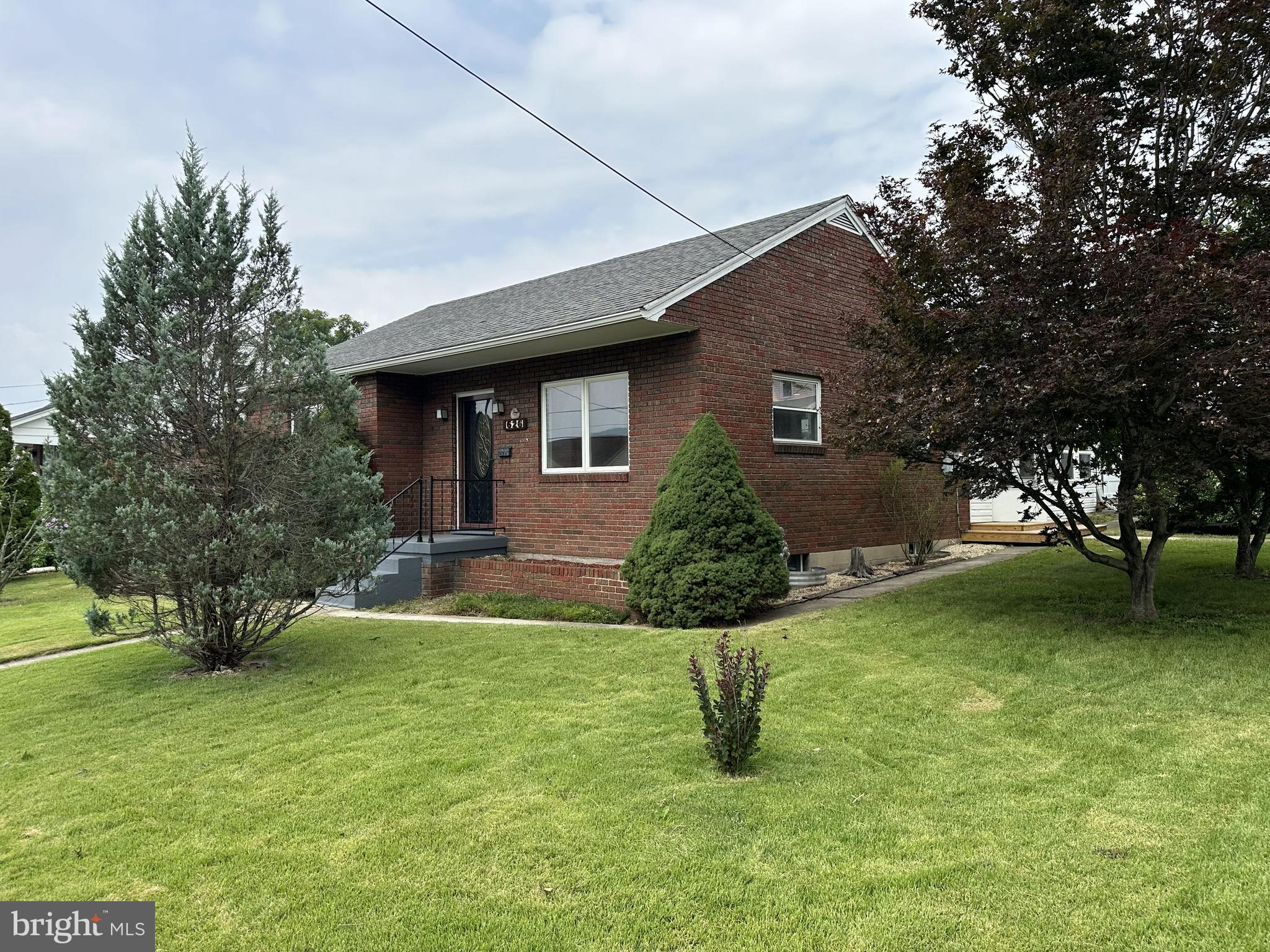 Nice brick ranch/bungalow in popular South Cumberland Location featuring a updated kitchen, hardwood floors, remodeled bathroom on main level, Full basement with potential for additional living space, hot water baseboard heat, replacement windows, upgraded wiring  and more. The property also has a large covered partially enclosed deck with addional outdoor deck space,  fenced rear yard, 1 car garage and fenced rear yard. The home has had fresh paint throughout.
