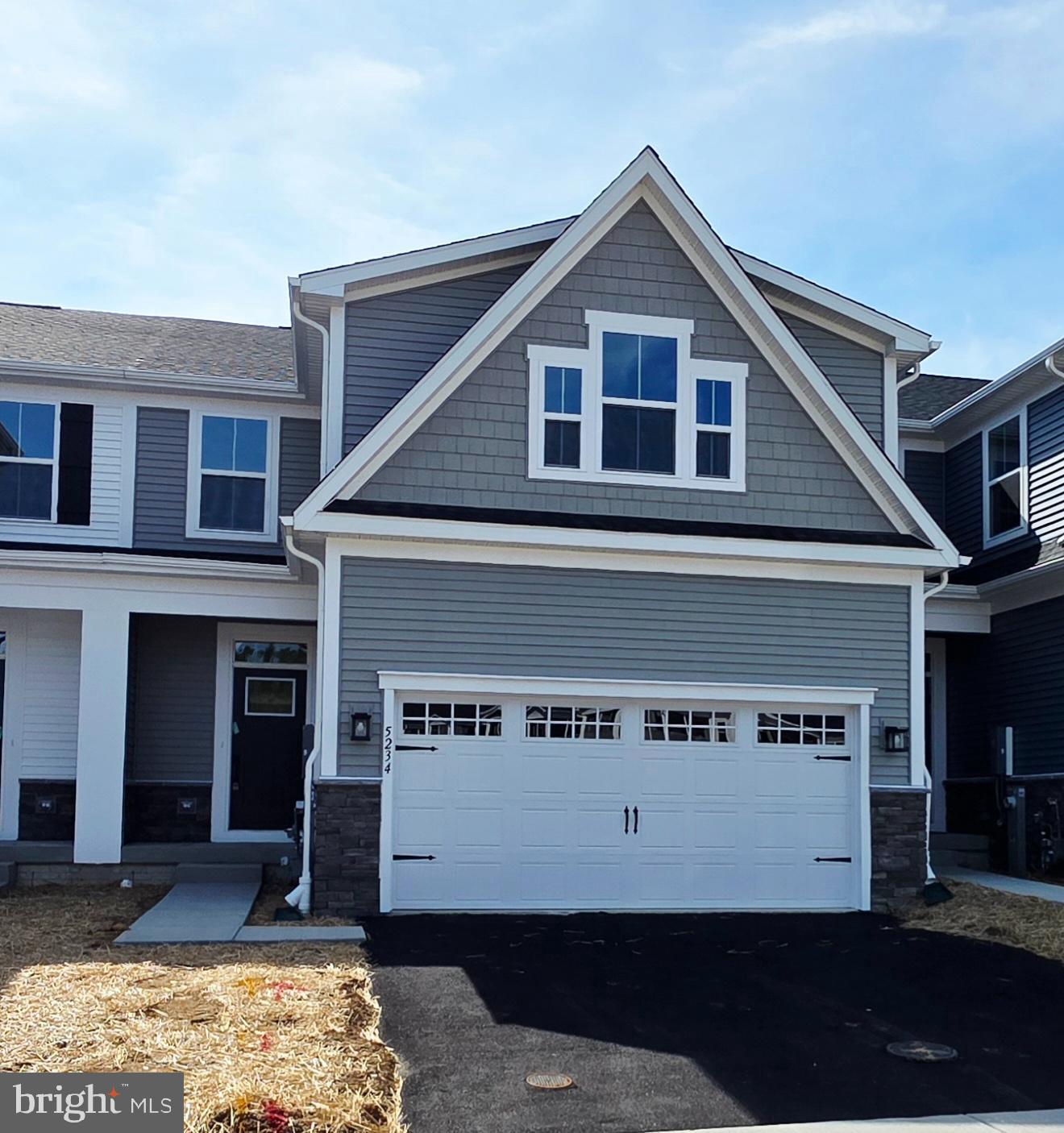 IMMEDIATE DELIVERY! NEWLY COMPLETED HOME NEVER LIVED IN! Agents - check the comps. The unit next door sold for $714K - same floorplan, same square footage. $100,000 lot premium - This is the only lot currently available that backs to open space and Liberty Reservoir. Welcome to Nell's Acres 55+ Villas, an active adult community. This stunning home, the Caroline model, offers main-level living featuring a first-floor owner's suite with dual vanities and walk-in closet, custom interior design with over $60,000 in upgrades and builder options,  a two-car garage, four bedrooms and 2.5 baths, a gourmet kitchen with an oversized quartz-topped island, a private home office and ample storage space, and a fully finished lower level with recreation room, 4th bedroom and full bath offering a total of 2,800 square feet of finished living space.
Also included is a covered, screened porch to take in the tranquil setting of the wooded homesite backing to forest conservation. Located in Carroll County's most sought-after location, Sykesville, Maryland, the community offers private homesites with wooded views and features a clubhouse, walking paths, and low-maintenance living, which means no more mowing, yard maintenance, or snow removal.
The area is within minutes of everything you need: shopping, restaurants, recreation, and medical care. These amenities make life easier and provide peace of mind, plus there is easy access to Route 26, Route 32, and I-70, making it easy to get wherever you want to go.