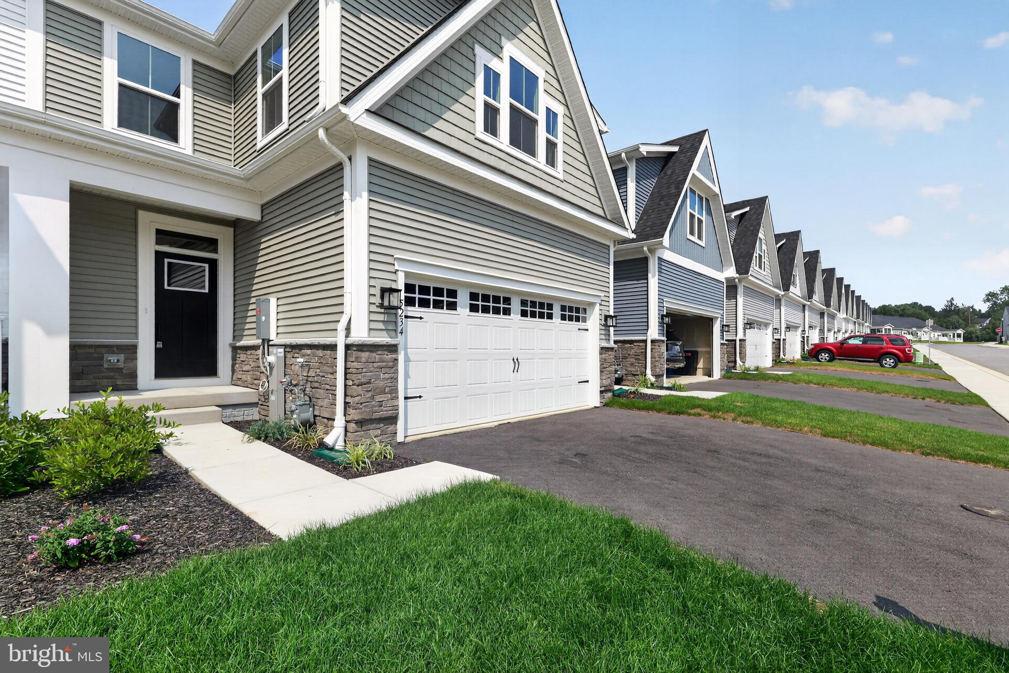 IMMEDIATE DELIVERY! NEWLY COMPLETED HOME NEVER LIVED IN! Agents - check the comps. The unit next door sold for $714K - same floorplan, same square footage. $100,000 lot premium - This is the only lot currently available that backs to open space and Liberty Reservoir. Welcome to Nell's Acres 55+ Villas, an active adult community. This stunning home, the Caroline model, offers main-level living featuring a first-floor owner's suite with dual vanities and walk-in closet, custom interior design with over $60,000 in upgrades and builder options,  a two-car garage, four bedrooms and 2.5 baths, a gourmet kitchen with an oversized quartz-topped island, a private home office and ample storage space, and a fully finished lower level with recreation room, 4th bedroom and full bath offering a total of 2,800 square feet of finished living space. Seller agrees to credit the Buyers for a washer, dryer, & refridgerator with an acceptable offer. 
Also included is a covered, screened porch to take in the tranquil setting of the wooded homesite backing to forest conservation. Located in Carroll County's most sought-after location, Sykesville, Maryland, the community offers private homesites with wooded views and features a clubhouse, walking paths, and low-maintenance living, which means no more mowing, yard maintenance, or snow removal.
The area is within minutes of everything you need: shopping, restaurants, recreation, and medical care. These amenities make life easier and provide peace of mind, plus there is easy access to Route 26, Route 32, and I-70, making it easy to get wherever you want to go.