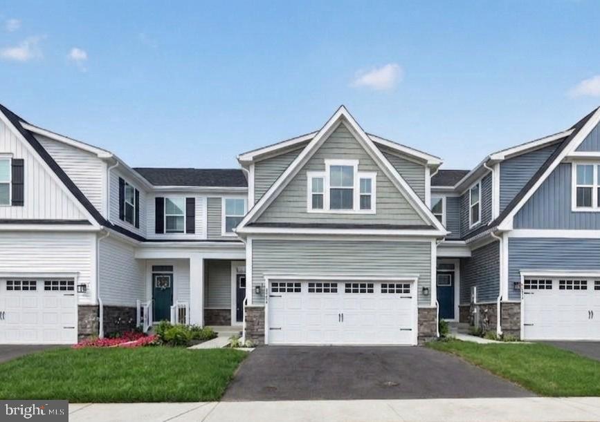 IMMEDIATE DELIVERY! NEWLY COMPLETED HOME NEVER LIVED IN! Agents - check the comps. The unit next door sold for $714K - same floorplan, same square footage. $100,000 lot premium - This is the only lot currently available that backs to open space and Liberty Reservoir. Welcome to Nell's Acres 55+ Villas, an active adult community. This stunning home, the Caroline model, offers main-level living featuring a first-floor owner's suite with dual vanities and walk-in closet, custom interior design with over $60,000 in upgrades and builder options,  a two-car garage, four bedrooms and 2.5 baths, a gourmet kitchen with an oversized quartz-topped island, a private home office and ample storage space, and a fully finished lower level with recreation room, 4th bedroom and full bath offering a total of 2,800 square feet of finished living space. Seller agrees to credit the Buyers for a washer, dryer, & refridgerator with an acceptable offer. 
Also included is a covered, screened porch to take in the tranquil setting of the wooded homesite backing to forest conservation. Located in Carroll County's most sought-after location, Sykesville, Maryland, the community offers private homesites with wooded views and features a clubhouse, walking paths, and low-maintenance living, which means no more mowing, yard maintenance, or snow removal.
The area is within minutes of everything you need: shopping, restaurants, recreation, and medical care. These amenities make life easier and provide peace of mind, plus there is easy access to Route 26, Route 32, and I-70, making it easy to get wherever you want to go.
