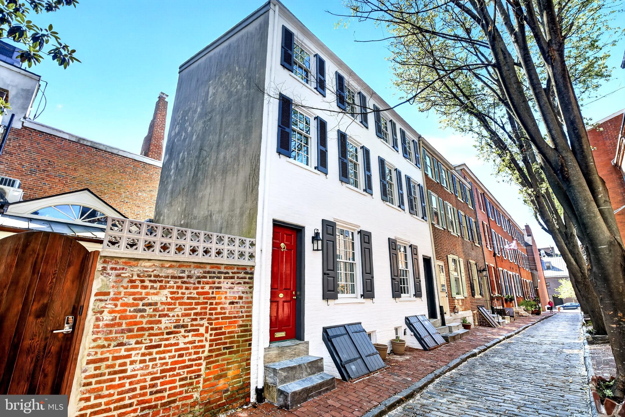 DEEDED SECURE PARKING!
Quintessential charm on one of Society Hill's most charming cobblestone streets  Welcome to a unique  double trinity which  has been totally restored using only the highest grade finishes.  The custom kitchen includes a  spacious pantry, and island. The high end appliances are a  Bosch induction cooktop range with beautiful hood,  Bosch dishwasher and French door refrigerator freezer. This well equipped kitchen opens to a dining/living area with a beautiful fireplace with ventless gas logs. The second floor offers a spacious primary bedroom with ensuite marble bath showcasing  a glass shower and double vanity.  The walk in closet is just waiting for the new owner to design the space to their own needs.  The third floor houses two bedrooms with double closets with French doors.  These bed rooms share a beautifully appointed alcove tub/shower, vanity and in wall tank toilet bathroom.  The fully finished lower level  has luxury vinyl flooring, a magnificent double sided fireplace with ventless gas logs and a wine cubby.  The new front load washer and dryer share a tile shelf with a stainless laundry sink.  The powder room sports new fixtures.  The mechanical room houses a tank less water heater and high velocity HVAC system.  All new electric 200 AMP service allows the freedom to live safely with more than adequate service to all.  There is also a closet on this level which contains the manifold and all new plumbing lines.  This little jewel box property has all solid living brass finish fixtures.  All floors of this lovingly restored property are tied together with a unique new, custom Chippendale stairway.  The spacious  backyard space has a delightful built in bench.   The windows  and doors are new, historically correct  low E  double pane glass.   New mechanicals include high velocity HVAC, 200 amp electrical system, pex plumbing, and tankless hot water heater.   The deeded parking is in a well lit gated lot just around the corner.  Parking fees are $1,200 annually which pays for maintenance, lighting, cameras, and snow removal.  10 year tax abatement is in process.