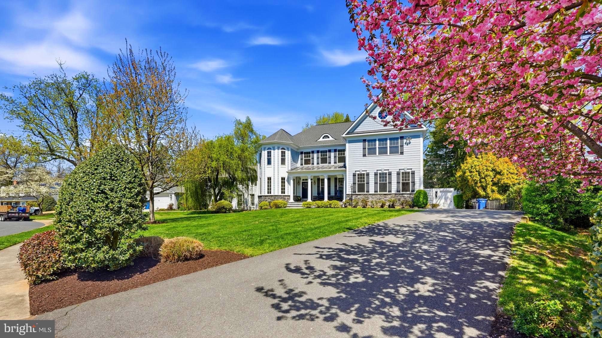 Come see this spectacular $1,000,000 plus renovation! This magnificent residence is a true sanctuary, offering a private resort-style backyard designed for entertainment and relaxation. A custom pool with automatic cover includes a sun shelf for lounging and cascading waterfall. The adjacent and elevated spa allows for easy transitions from a refreshing swim to a soothing soak. A covered pavilion overlooking the pool offers an outdoor kitchen for al fresco dining or unwinding in the shade just steps from the pool. The pool is surrounded by multiple lounge areas, a built-in fire pit, and screened-in porch with ceiling heaters—all of which create a sublime setting for unforgettable gatherings. 
Inside, gorgeous and thoughtful details throughout include decorative moldings, specialty hardwood flooring, tray ceilings with cove lighting, and bay windows that make for a light-filled home. The main level consists of an inviting entry foyer that opens to formal dining and living rooms, and a natural light-filled sunroom with windows on 3 sides offering the perfect setting for a home office, crafting space, or cheerful playroom. The inviting family room showcases beautiful French doors that provide seamless access to the outdoor living area. The generous gourmet kitchen is anchored by a large island with bar seating and complemented by a bespoke appliance package with adjacent coffee station/wet bar that includes an under-counter ice maker and beverage fridge. Breakfast room with French doors open to a stunning screened-in porch which overlooks swimming pool and pavilion. The upper level has 5 bedrooms, one of which offers a flexible space that can easily transform into a comfortable sleeping area, a home office, or a seamless combination of both. The large primary suite offers a walk-in closet, newly renovated (2026) bath with soaking tub, separate shower and dual vanities. The laundry is upstairs in the spacious landing. Lower level is light and bright with generous room sizes, complete with exercise room, recreation room, ample storage areas, and a 6th bedroom with a full bath providing exterior access via French doors leading out to the resort-style backyard—ideal for an au pair or in-law suite. 
The backyard is set on a beautifully flat and private lot that has been professionally landscaped with barrier evergreen trees, irrigation, and lighting. All of this sits on a quiet cul-de-sac, just one stoplight to DC and a quarter mile from the GW Parkway—a commuter’s dream!
