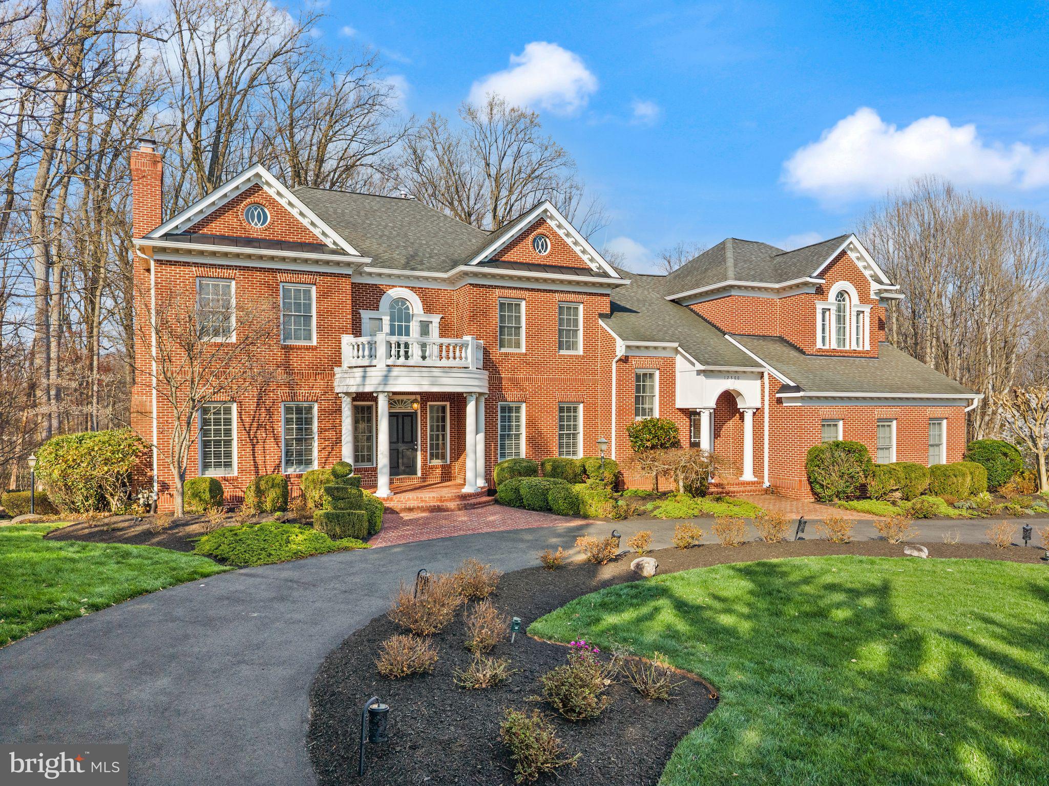 ** All offers should be submitted by 3PM EST, Monday,  April 13,2026.***
A masterpiece of refined living, this magnificent all-brick custom home commands a breathtaking 5-acre private retreat backing to serene woodlands and parkland — an extraordinary sanctuary where natural beauty and elegant design meet. Perfectly positioned with effortless access to Braddock Road and Fairfax County Parkway, this coveted address delivers the best of both worlds: tranquil seclusion and seamless connectivity. The celebrated Queensbury Model by Keystone Builders impresses at every turn with soaring 10' main-floor ceilings, a grand 2-story family room framed by spectacular wooded vistas, dual hardwood staircases, and a sun-drenched rear solarium. The exquisitely reimagined gourmet kitchen is a culinary statement — anchored by a 48" Thermador professional cooktop, double oven, iconic SubZero refrigerator, and a dramatic quartz waterfall island worthy of the finest entertaining. Over $250K in curated upgrades elevate every corner: gleaming refinished hardwood floors, designer lighting, bespoke plantation shutters, artisan custom millwork, and a breathtaking floor-to-ceiling fireplace as the living room's crown jewel. The fully permitted walkout lower level offers resort-style living with a chic bar, private gym, and spa-inspired bath. Outside, a generous deck, custom stone patio, outdoor fireplace, and tranquil pond create an unrivaled al fresco escape. Meticulously upgraded and flawlessly move-in ready — this is the one.