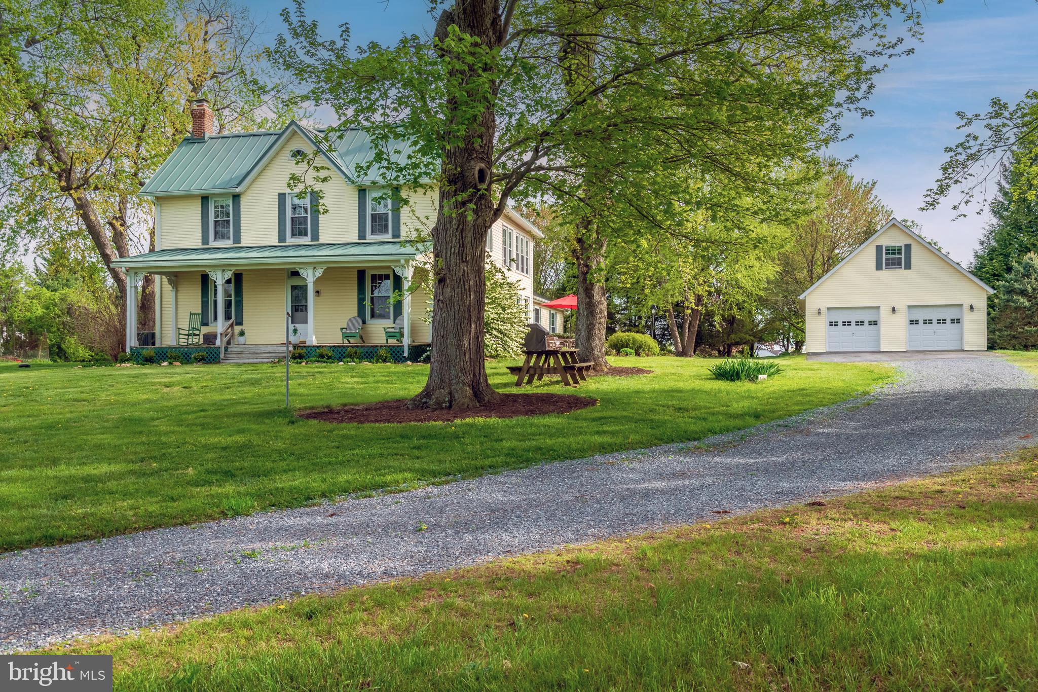 BIG PRICE DROP! EXCEPTIONAL OPPORTUNITY!

Welcome to 21901 New Hampshire Avenue, a rare 22-acre  beautifully maintained and updated countryside retreat in Brookeville, offering the perfect blend of rural charm, privacy, and modern comfort. Ideal for HORSE ENTHUSIASTS, HOBBY FARMERS , or anyone seeking a peaceful country lifestyle, this unique property provides ample space for HORSES, CHICKENS,SHEEP, GOATS, gardens, and outdoor recreation.

This move-in ready farmhouse has been thoughtfully updated while maintaining its timeless character. SOME UPDATES AND IMPROVEMENTS:
2026: 30 & 50 GALLON NEW ELECTRIC WATER HEATERS
 PAINTING, GARAGE ROOF CAPPING
2024: KITCHEN BACKSPLASH, LIGHT FIXTURES, 2 UPSTAIRS BATHROOM REMODELS
2021: REAR CHIMNEY REBUILDS,
2020: FRONT CHIMNEY REBUILDS, METAL ROOF OVER MAIN HOUSE, WELL PUMP, WATER SYSTEM UPDATES
2017: FIRST FLOOR  BEDROOM & BATH REMODEL, PRIMARY CLOSET ADDITION, HEAT PUMP SECOND FLOOR , WATER HEATER REPLACEMENT,
2016:  HEAT PUMP INSTALLATION FOR FIRST FLOOR

Bright country kitchen with center island, a stunning family room with vaulted ceilings and fireplace and wonderful living space throughout.

Eleven acres are protected by a conservation easement, preserving the property's natural beauty and scenic views. Several outbuildings, including a corn barn, poultry house, and additional agricultural structures, offer endless possibilities for equestrian use, farming, storage, workshops, or hobbies. All outbuildings convey in "as is" condition.

The detached two-car garage features a full bath and a finished upper level space ideal for ART STUDIO, HOME OFFICE, GUEST SUITE, FITNESS ROOM, or additional living area.

Located near parks, nature preserves, riding trails, and equestrian facilities, this exceptional property offers a rare opportunity to enjoy country living while remaining close to shopping, dining, and commuter routes.

Don’t miss the chance to own this truly exceptional countryside haven!