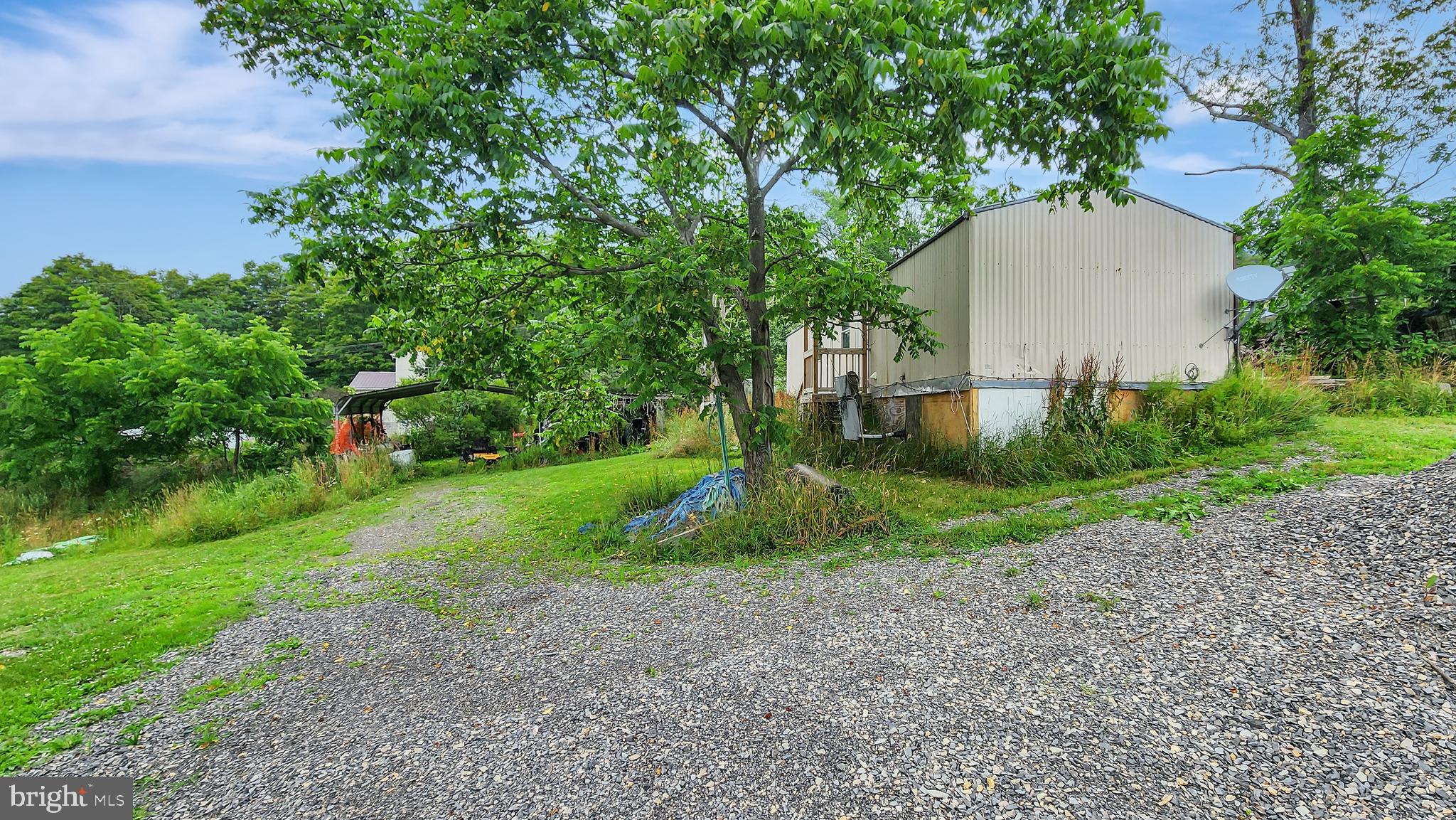 This could be a chance to be a great place to call home with some TLC. Large Yard, Huge driveway, Awesome views, and soooo much potential.