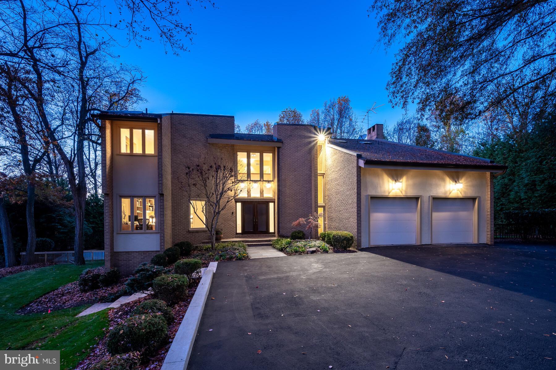 Situated on a quiet cul de sac in North Bethesda’s most sought after neighborhood, this home is timeless and perfect for today’s lifestyle. Custom-built for these original owners, it incorporates an open floorplan with 5700 square feet of living space beautifully sited on a private half an acre, conducive to today’s more informal living. Gracious landscaping surrounds the property, and a newly renovated heated pool and flagstone patio, makes for ideal outdoor living. Located in the heart of the popular Luxmanor neighborhood, this wonderful home enjoys easy access to I-270 and I-495, close proximity to the Green Acres/Diener School, Luxmanor ES and Tilden MS, as well as two neighborhood pools, several county parks, shopping and restaurants including Pike and Rose, Wildwood Shopping Center and Westfield Montgomery Mall.
The interior is special. The “user-friendly” floorplan features a two-story, 18’ entry Foyer with balcony overlook and clerestory windows above the double-door entry with etched glass side panels. The first floor has nine-foot ceilings throughout. A focal point of the Main Level is the large Living Room with skylights in the vaulted ceiling and a wood-burning fireplace with marble trim and hearth. Both the Living Room and Dining Room have doors to the deck and overlook the backyard and swimming pool. A Home Office (or Study) with built-ins is conveniently located off the Foyer.
Informal comfort reigns with a Kitchen that has been renovated and updated with upgraded stainless-steel appliances, including a side-by-side Subzero refrigerator and freezer; Wolf cooktop and double wall ovens and microwave; natural, light stained cabinetry; an island perfect for informal meals; and a desk area for the home computer. Open to the Family Room with eating space and a second wood-burning fireplace, this area is perfect for more relaxed living.  Adjacent to the Family Room is an “All Seasons” Porch with deck and staircase to the backyard, which makes the pool and patio readily accessible from the Kitchen and Family Room. Completing the first floor is a Full Bathroom/Powder Room and a wonderful Mudroom with wine cooler, pantry, built-in ice machine, coat closet, additional counter space, and cabinets, with access to side yard and the oversized, two-car Garage.
The Upper Level has also been well thought out with a large Primary Suite with two Full Bathrooms, one with a whirlpool tub and the other a with stall shower, as well as a large, organized Walk-in Closet. Adjacent to the Primary Suite is a Sitting or Exercise Room with atrium door to the Upper Level Deck. Three additional Bedrooms and third and fourth Full Bathrooms as well as a Laundry room with large Walk-in Closet and Storage area, complete the Upper Level.
The Lower Level is open and has new carpeting and offers lots of options for the most discerning buyer. Currently the Recreation Room with third fireplace walks out to the pool and patio, and a Game Room with Sitting Area could also be a large play area. The Storage/Utility Room provides extra storage space as well as a rough-in for a future Bathroom.