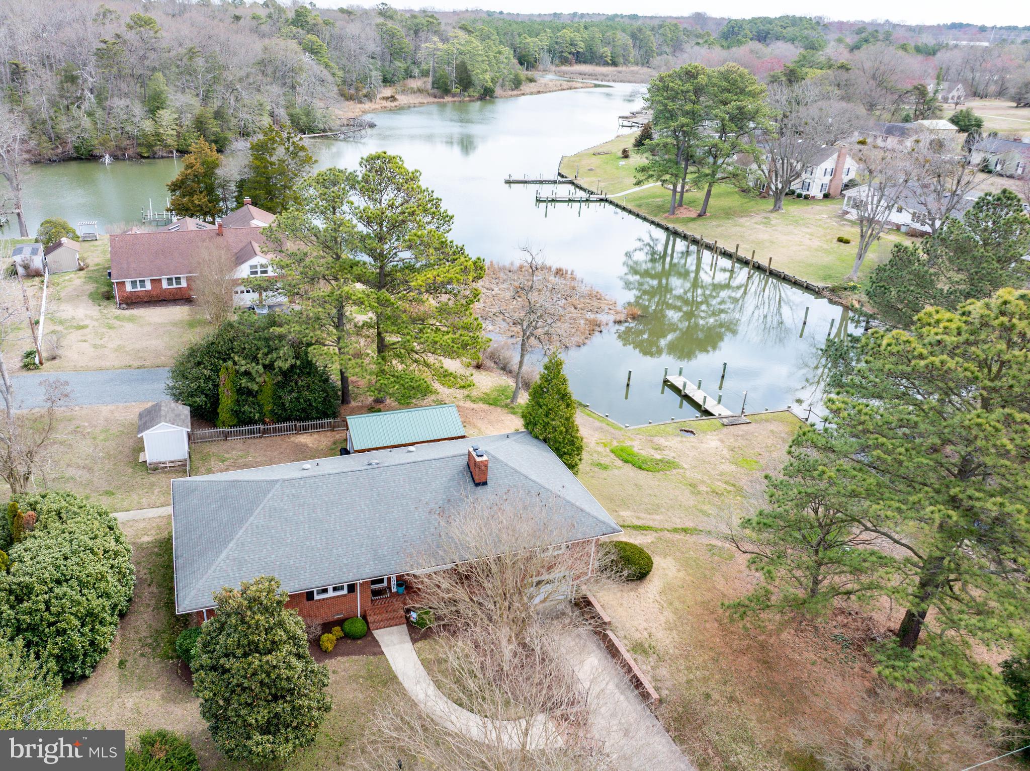 Discover this beautifully renovated 2-bedroom, 2-bathroom brick, 1-level home, perfectly situated on the serene Whitehall Creek. This inviting property features a spacious family room with a cozy wood-burning fireplace, creating a warm and welcoming atmosphere. The full unfinished basement and attic provide ample storage.  Basement is great for fitness or hobbies.

Step outside and embrace waterfront living with a 12x20 pavilion, ideal for outdoor entertaining, plus an outdoor shower, shed, and a private dock with water & electric, perfect for boating, fishing, or simply soaking in the tranquil views. The attached 1-car garage adds convenience, while the peaceful setting makes it easy to relax with your morning coffee or an evening cocktail.

Sale includes two parcels for a total of .51 acres. 

Don't miss this rare opportunity to own a piece of waterfront paradise—schedule your showing today!